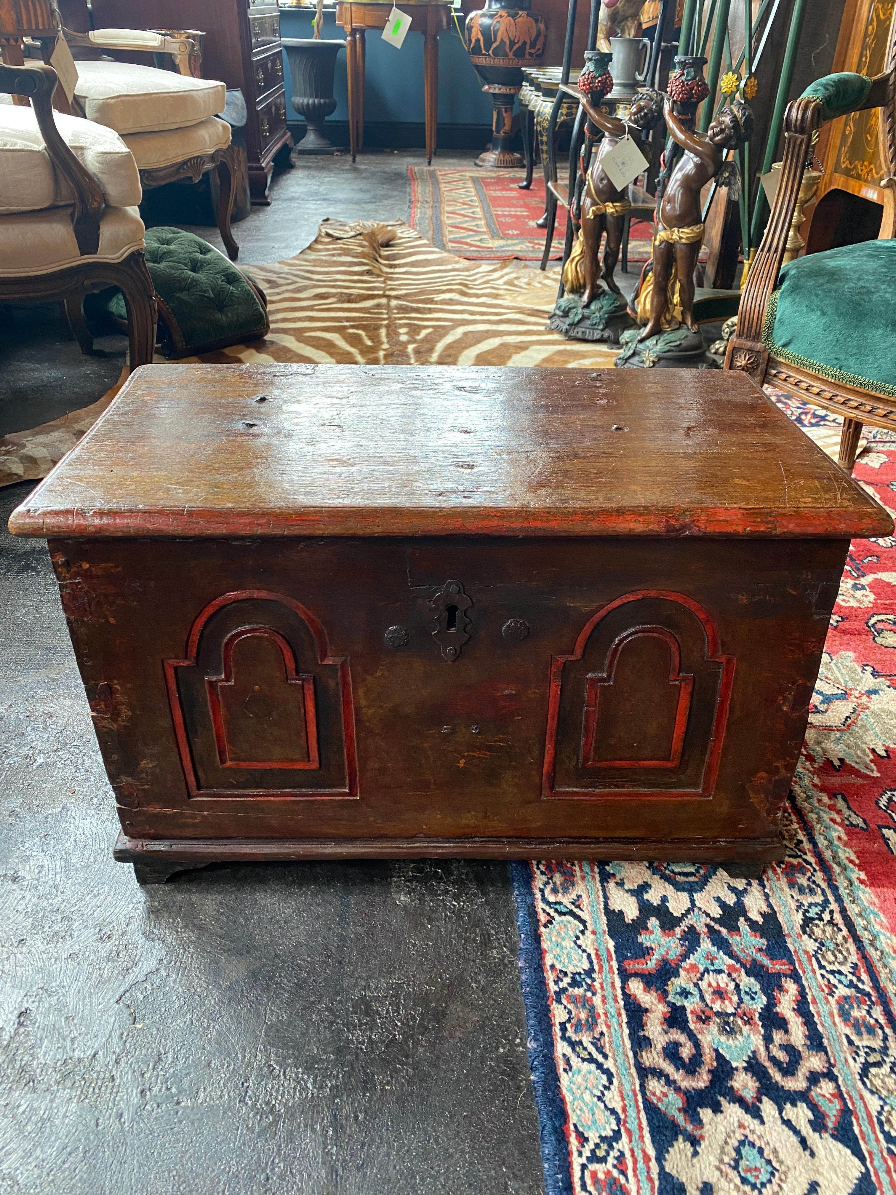 This is a handsome 18th century Continental trunk. This one is smaller in size. Some repairs are evident. The right side handle is not original. Warm patina on the surfaces. 

Measures: 24