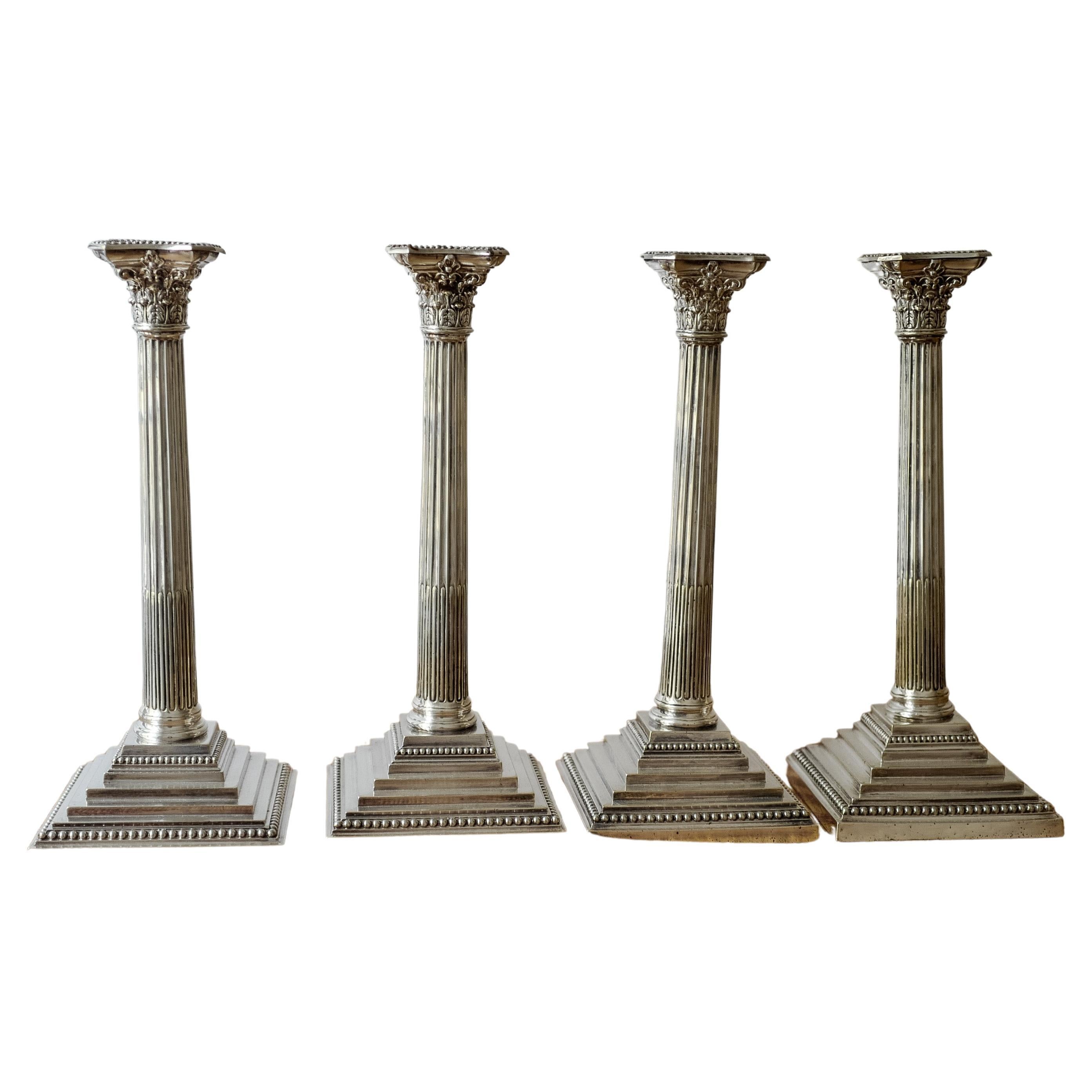 Set of Four 18th Century Sterling Silver Corinthian Candlesticks For Sale