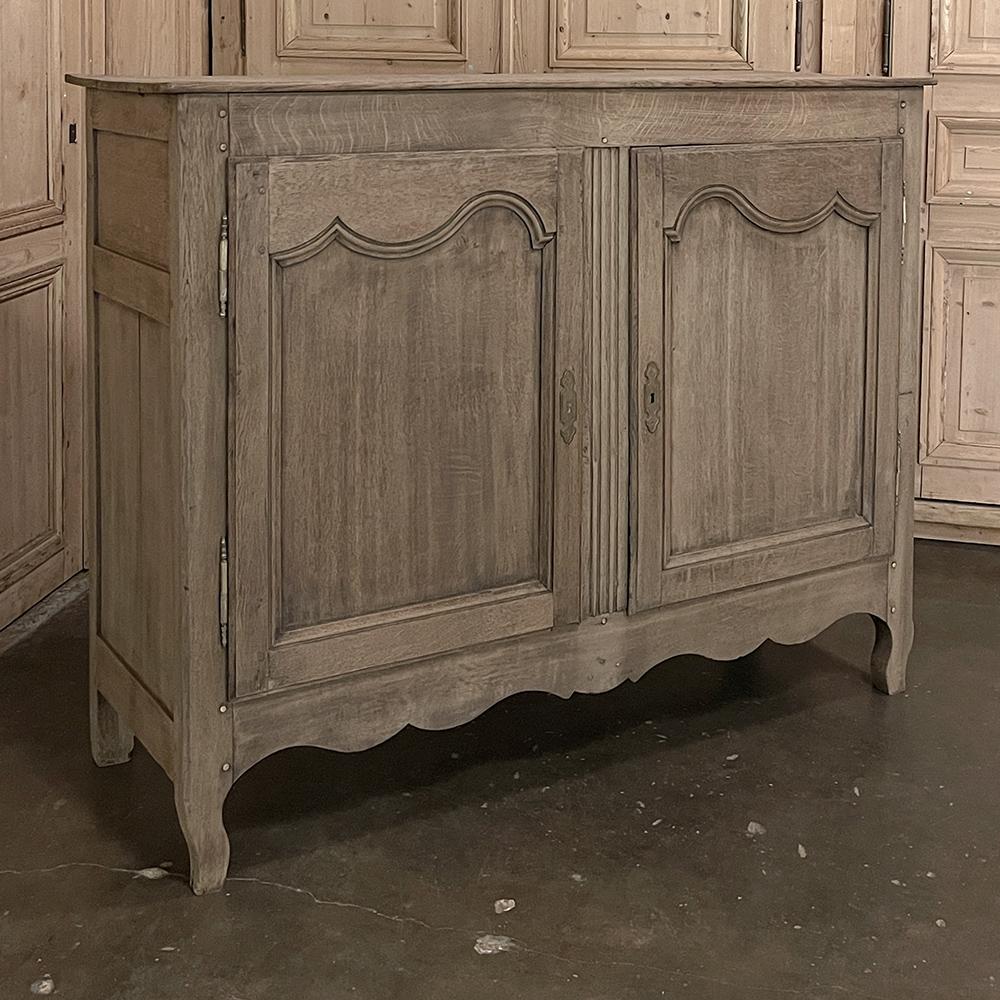 18th century Country French buffet in stripped Oak is a splendid example of time-honored traditions of craftsmanship, combined with the talents of the rural artisans of France! Utilizing dense, seasoned old-growth indigenous oak, its visual appeal