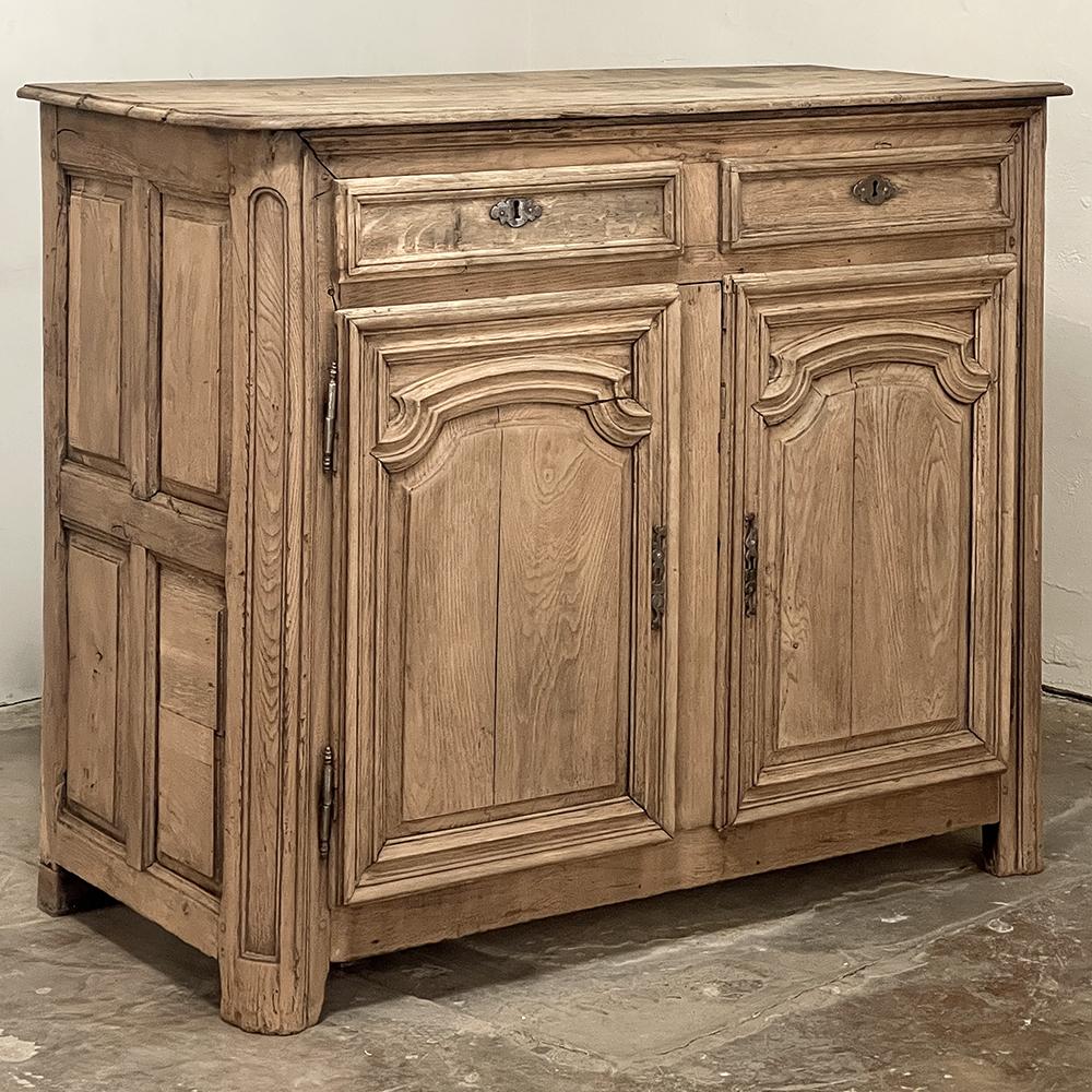 18th century country French Buffet in Stripped Oak is a testament to the rural artisans who produced amazing works of cabinetry using what today would be considered primitive tools. Taking advantage of the abundant old-growth oak in the region, they