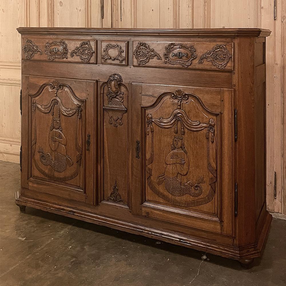 18th century Country French buffet with mermaids is a very unusual example of hand-crafted excellence, rendered from old-growth indigenous oak to last for centuries! Crafted on what was then considered a grand scale, such pieces were not only