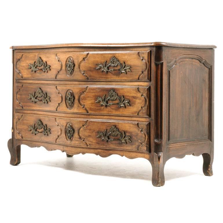 Very rare, country French, solid walnut hand-carved commode. Beautiful patina and highly ornate brass detailing. Late 18th century, circa 1780. In excellent original condition.


 