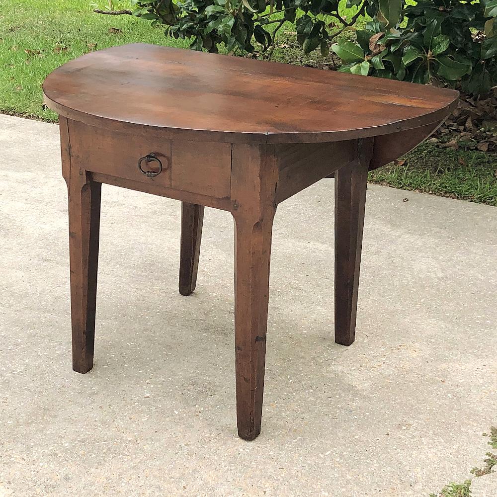 18th century Country French drop leaf game table ~ console is a remarkable artifact from the 1700s when entertainment consisted of table games, outdoor sports and music. This interesting table, hand-crafted from solid old-growth walnut, features the