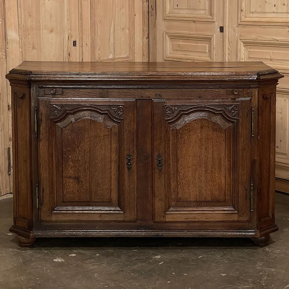 18th Century Country French Louis XIV Buffet is a handsome piece that was designed to provide storage, display and serving surfaces, and visual appeal all in one! Although the design is 23