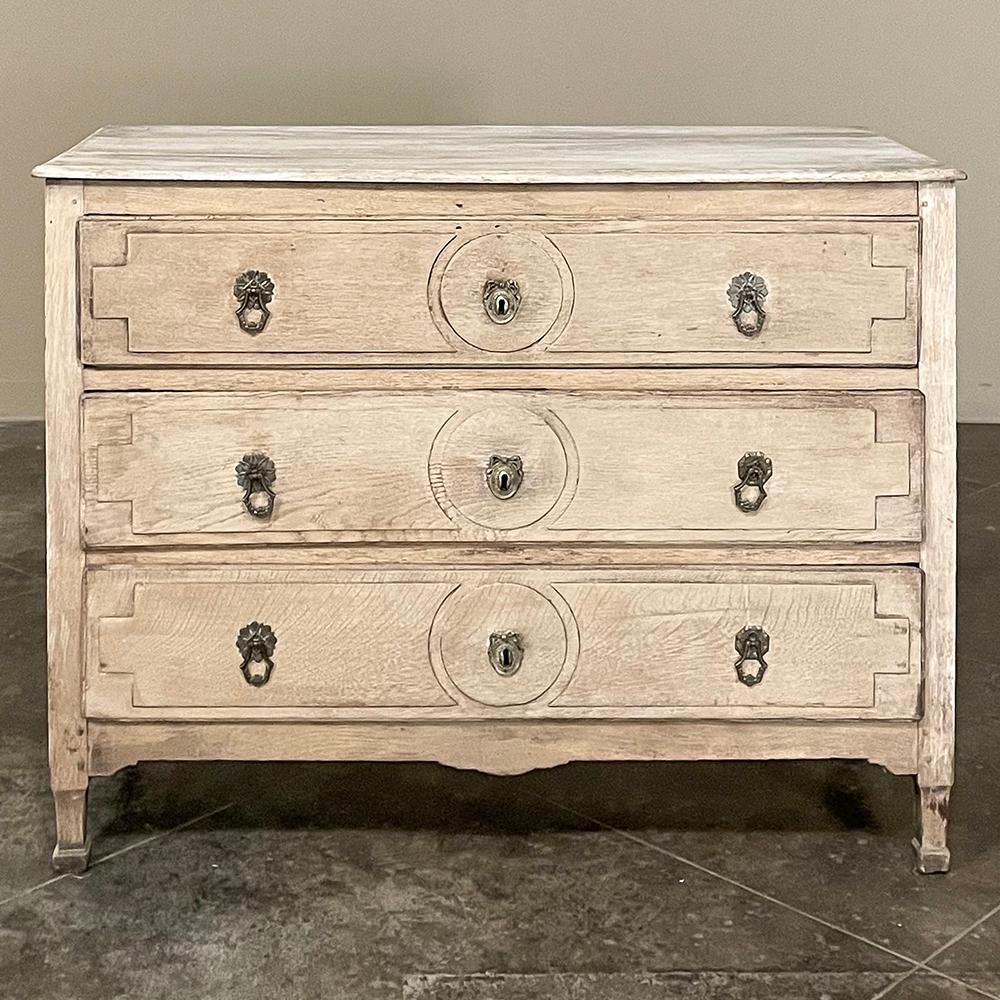 18th Century Country French Louis XVI Commode in Stripped Oak is a late period piece that retains the neoclassical design and architecture that was revived during the last years of the era.  Our proprietary stripping process retains the natural