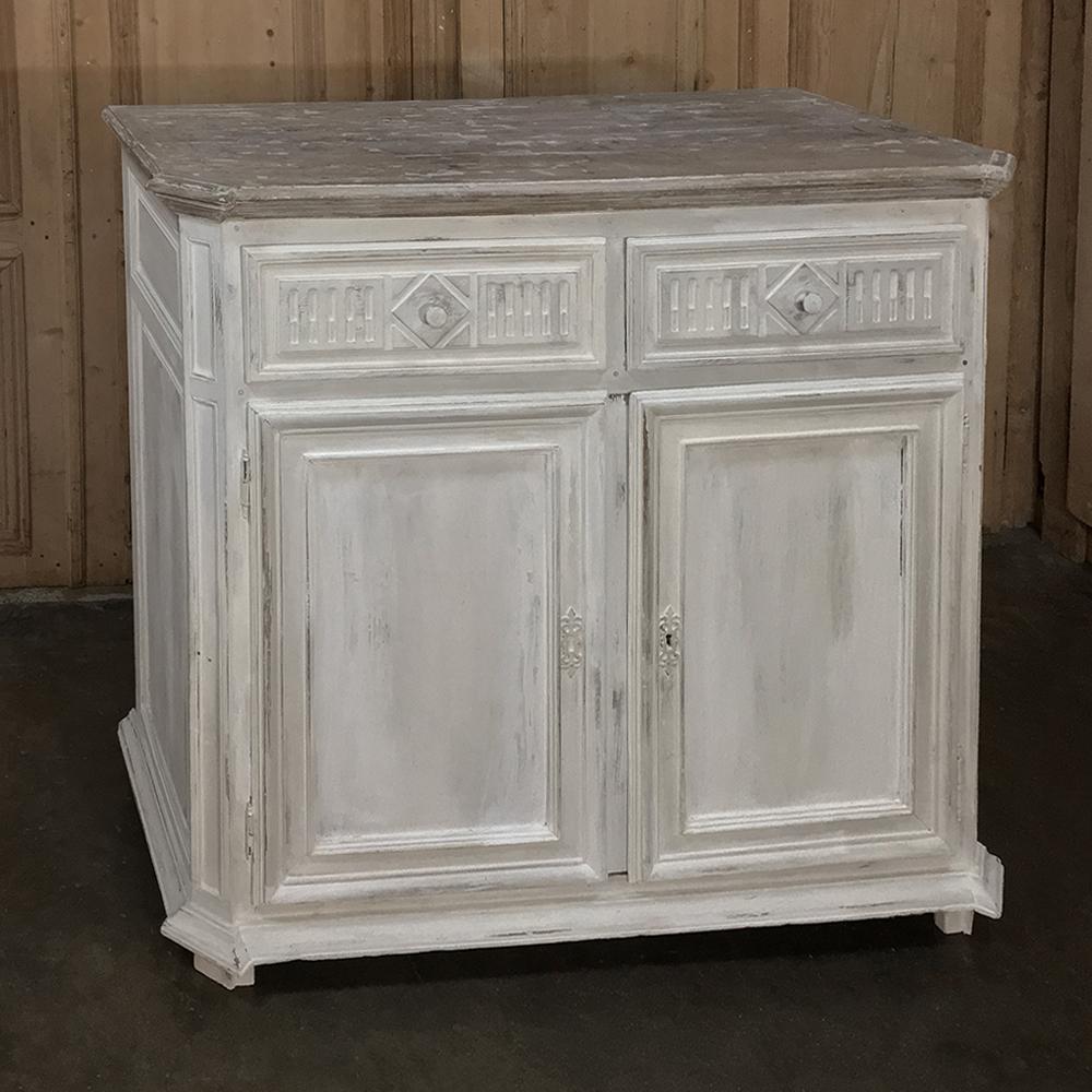 Graceful 18th Century Country French Louis XVI Painted Buffet adds a lightness to the room while also providing a refined look with simple, timeless lines. The aged white painted finish of the casework below provides subtle contrast to the more gray