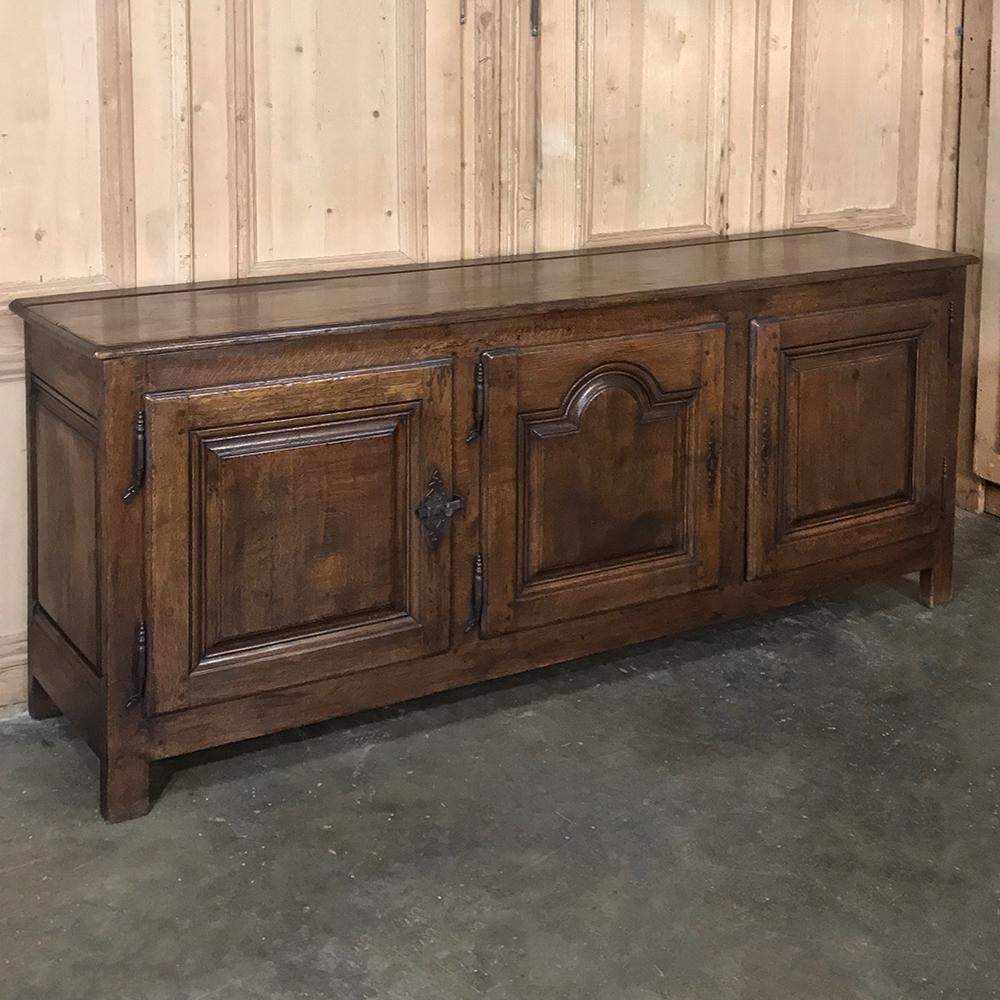 18th century Country French Provincial low buffet represents the essence of the genre, with tailored lines expertly executed by talented rural artisans who created masterworks to last for centuries from the local indigenous woods such as oak in this