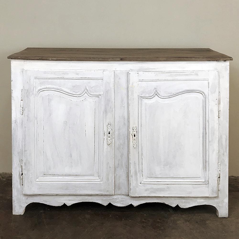18th Century Country French Provincial Painted Buffet boasts tailored, elegant lines that combine with the distressed painted finish to create a light and airy look that is compatible with a wide variety of casual decors!  The tailored upper door