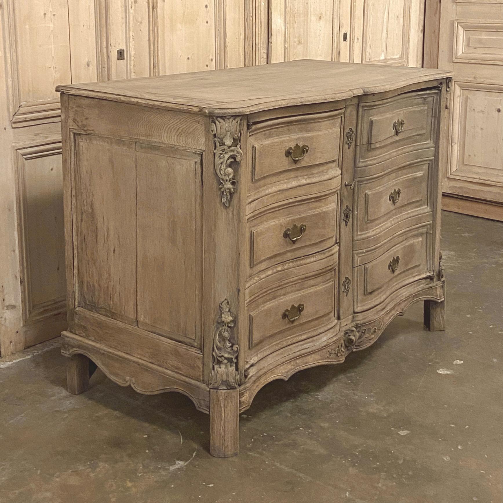 18th century Country French Provincial buffet features an arbalette, or Archer's bow, facade sculpted and embellished from solid oak to last for centuries! Amazingly, it appears to be a commode, but the false facade opens up to reveal a spacious