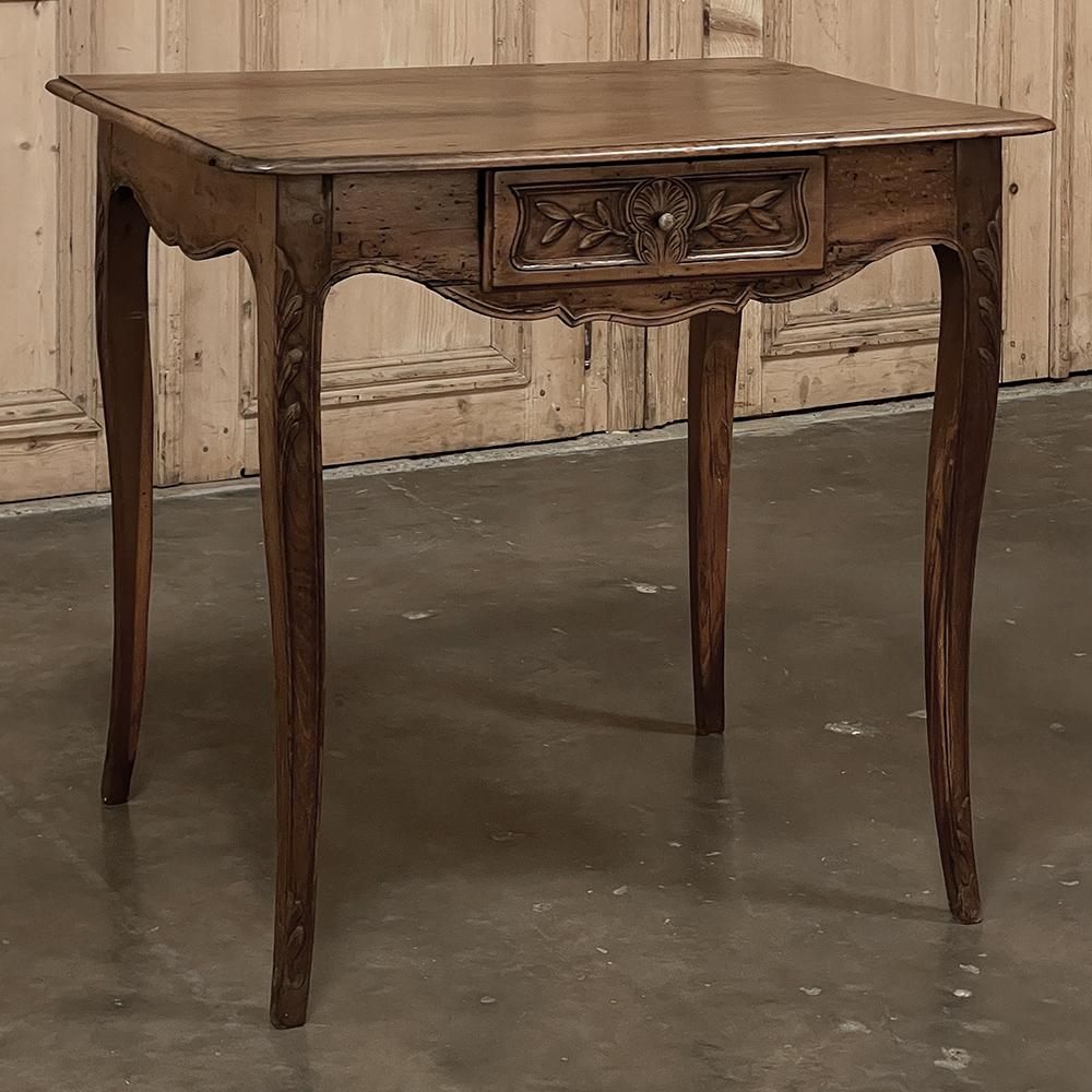 18th century Country French walnut end table simply exudes rustic charm! The beveled top was cut from a single huge plank of old-growth walnut in the days when such large trees were more than plentiful, and a delight to work with the carpenter's