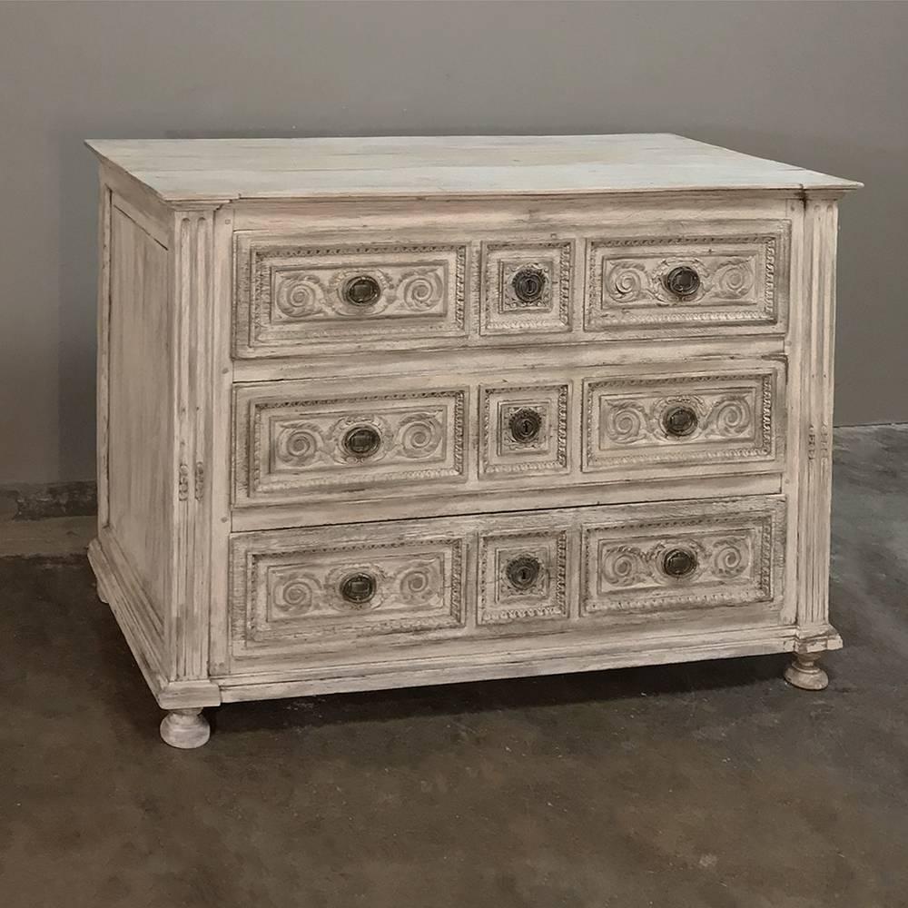 18th century country French whitewashed Louis XVI commode is a classic example of how talented rural artisans followed the lead of the important furniture makers of Paris, who catered to the whims of the court. This example, rendered by hand from