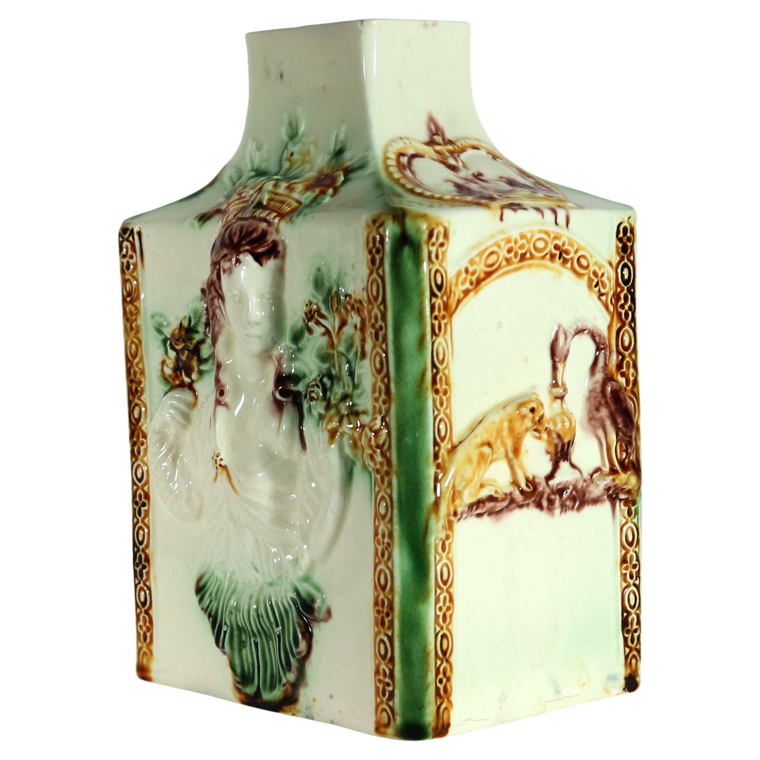 18th-Century Creamware Whieldon-type Large Molded Tea Caddy,
Fauna & The Aesop's Fable of The Fox and Stork,
Staffordshire or Bovey Tracey,
 Circa 1770-5

The oversized creamware tea caddy or cannister is  decorated in underglaze oxide colors.  It