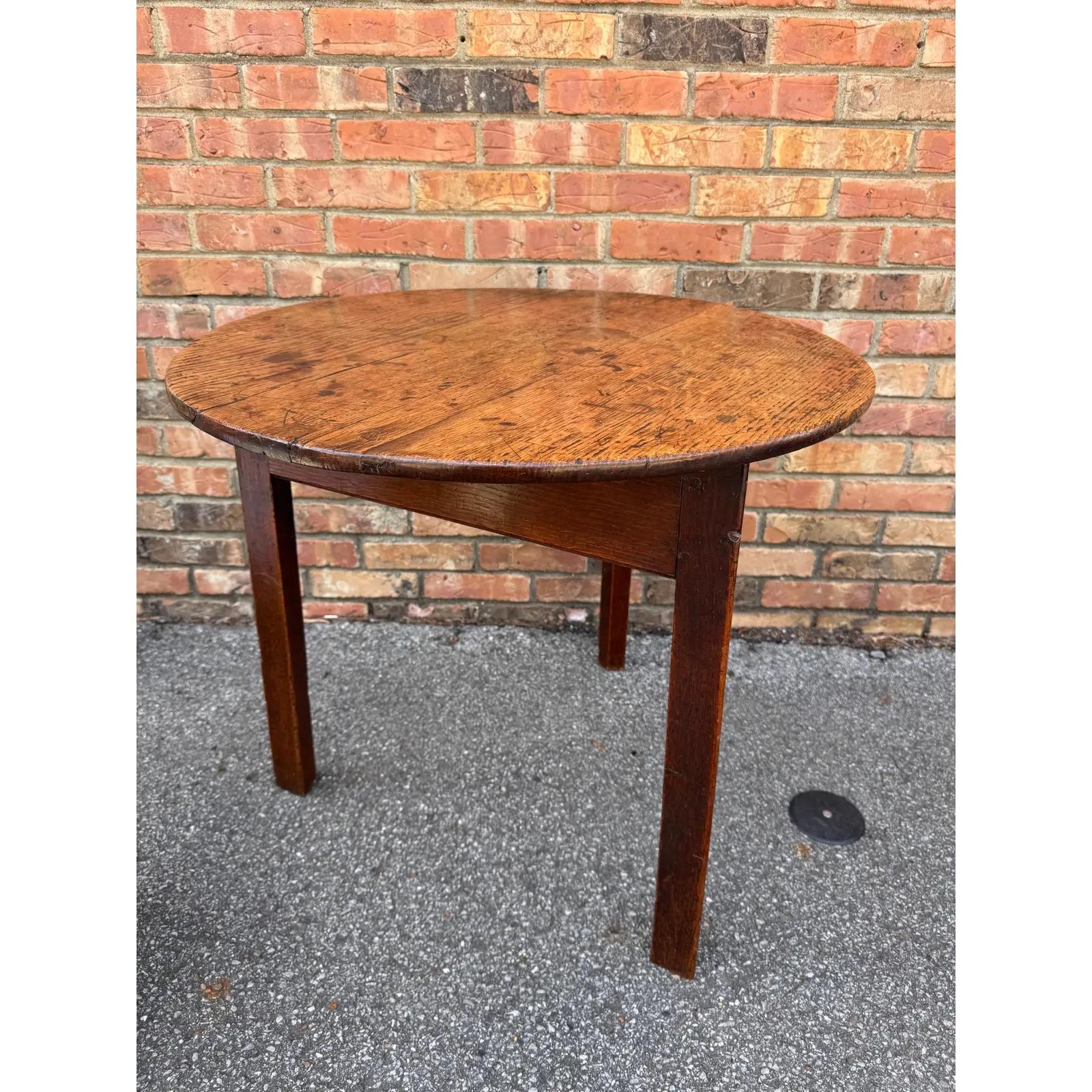This English cricket table is wonderfully patinated and showcases the lovely grain found within the round top. The base is triangular with a deep apron and 3 linear legs. Many of these tables were used as scorekeeper’s table for the British game of