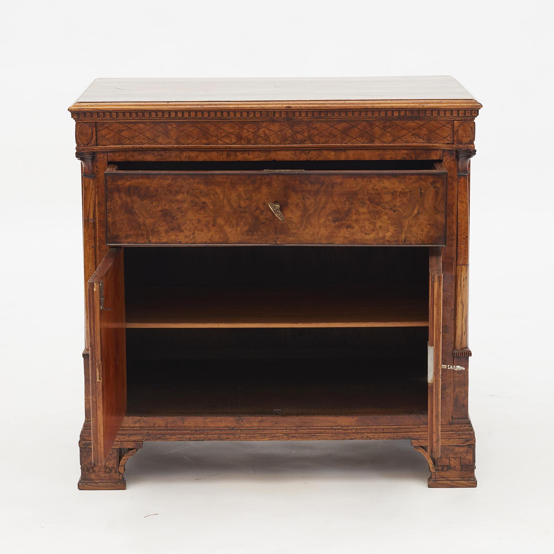 Elm burl veneered Louis XVI commode / dresser with many elegant details. Pair of fluted doors under a single top drawer. Inside two shelves. Architectural and beautifully executed. Oak and elm burl veneer,
Denmark, circa 1780-1790.