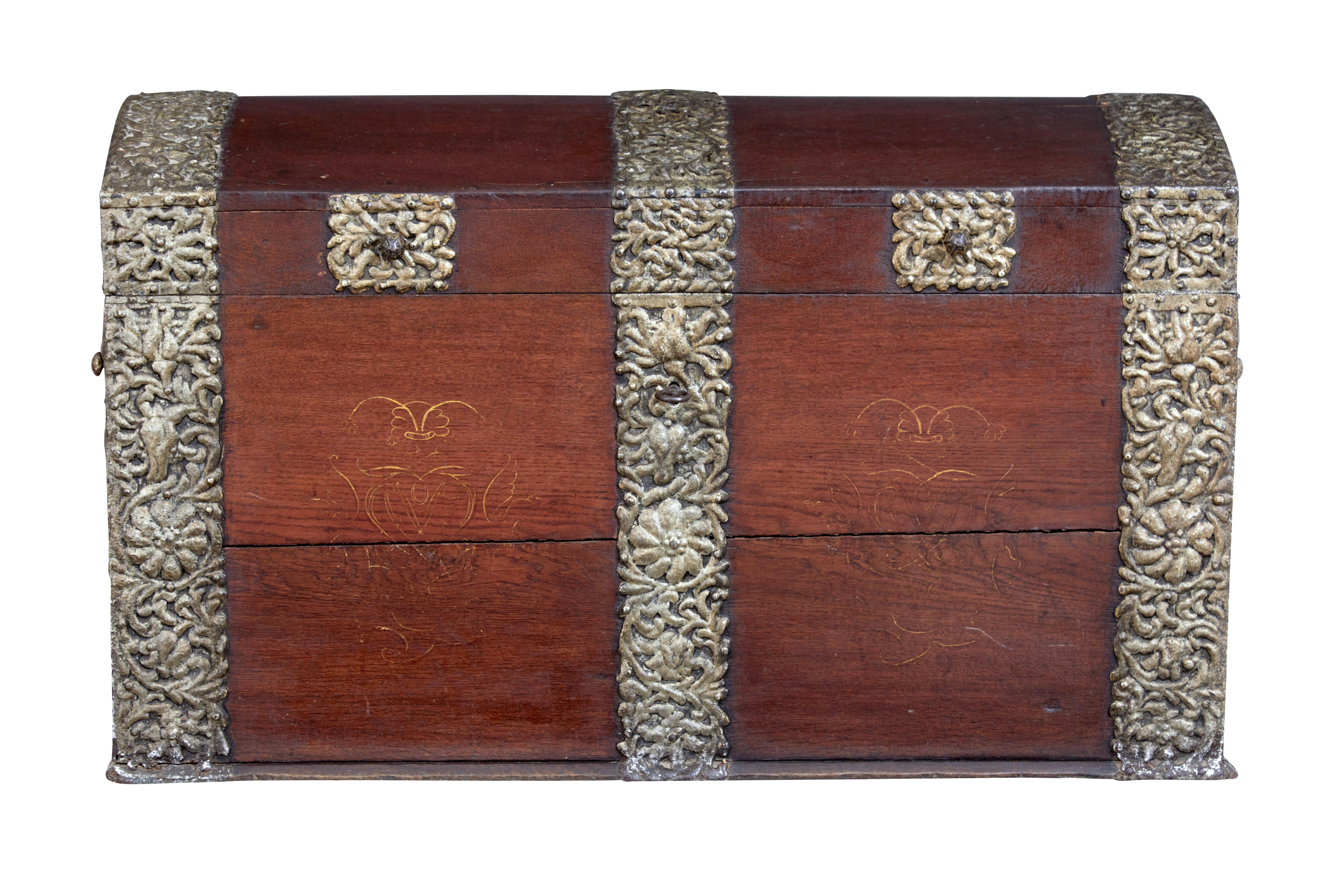 18th century Danish oak dome top coffer, circa 1790.

Beautiful dome top coffer made from solid oak, and decorated with ornate strap work. Lid opens to reveal a partially fitted interior consisting on a candle box.

Strap work on both ends and