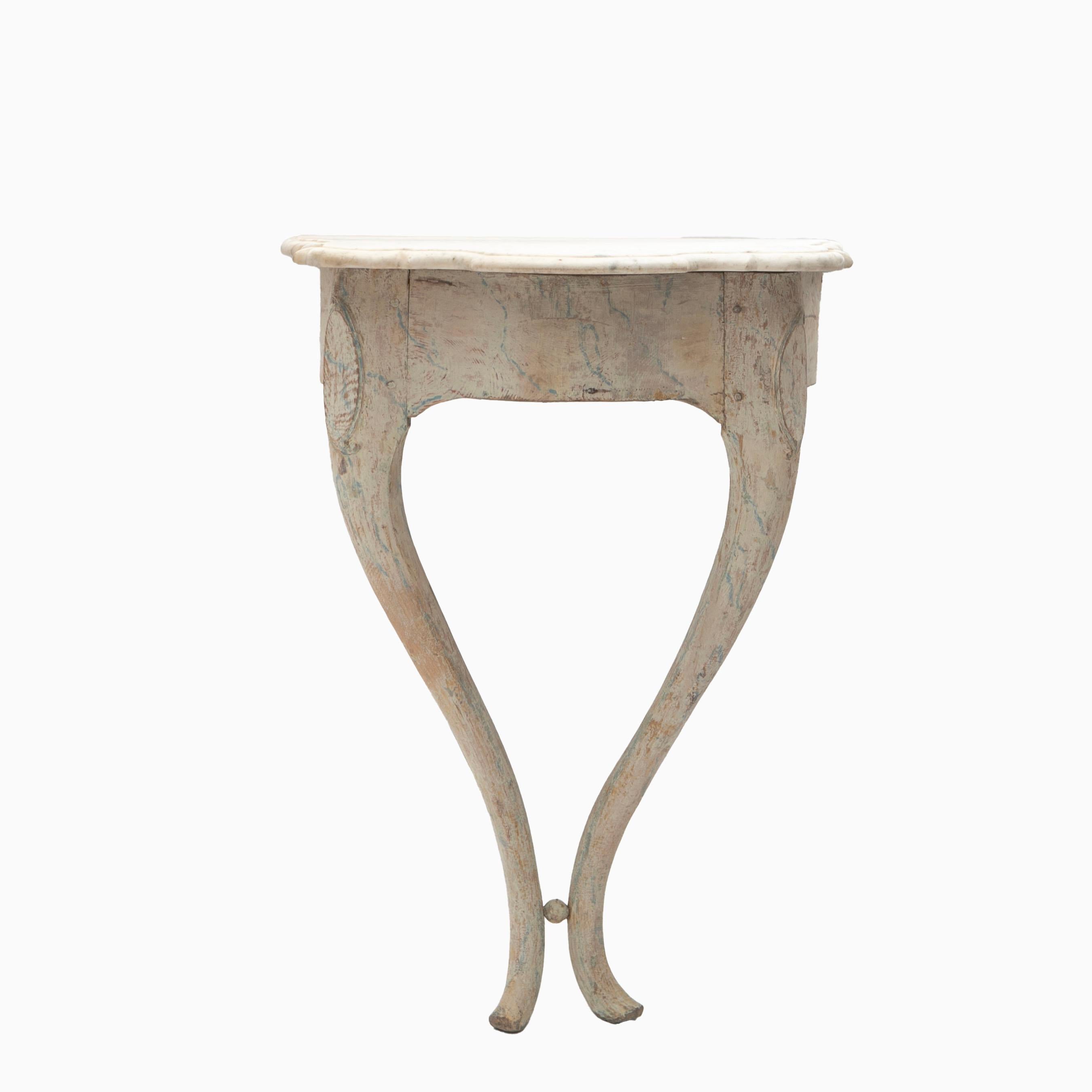 Rococo console crafted from pine, meticulously stripped by a conservator to reveal its original, beautiful gray-marbled finish with natural patina.

The console is topped with its original Italian white marble surface, featuring an elegantly