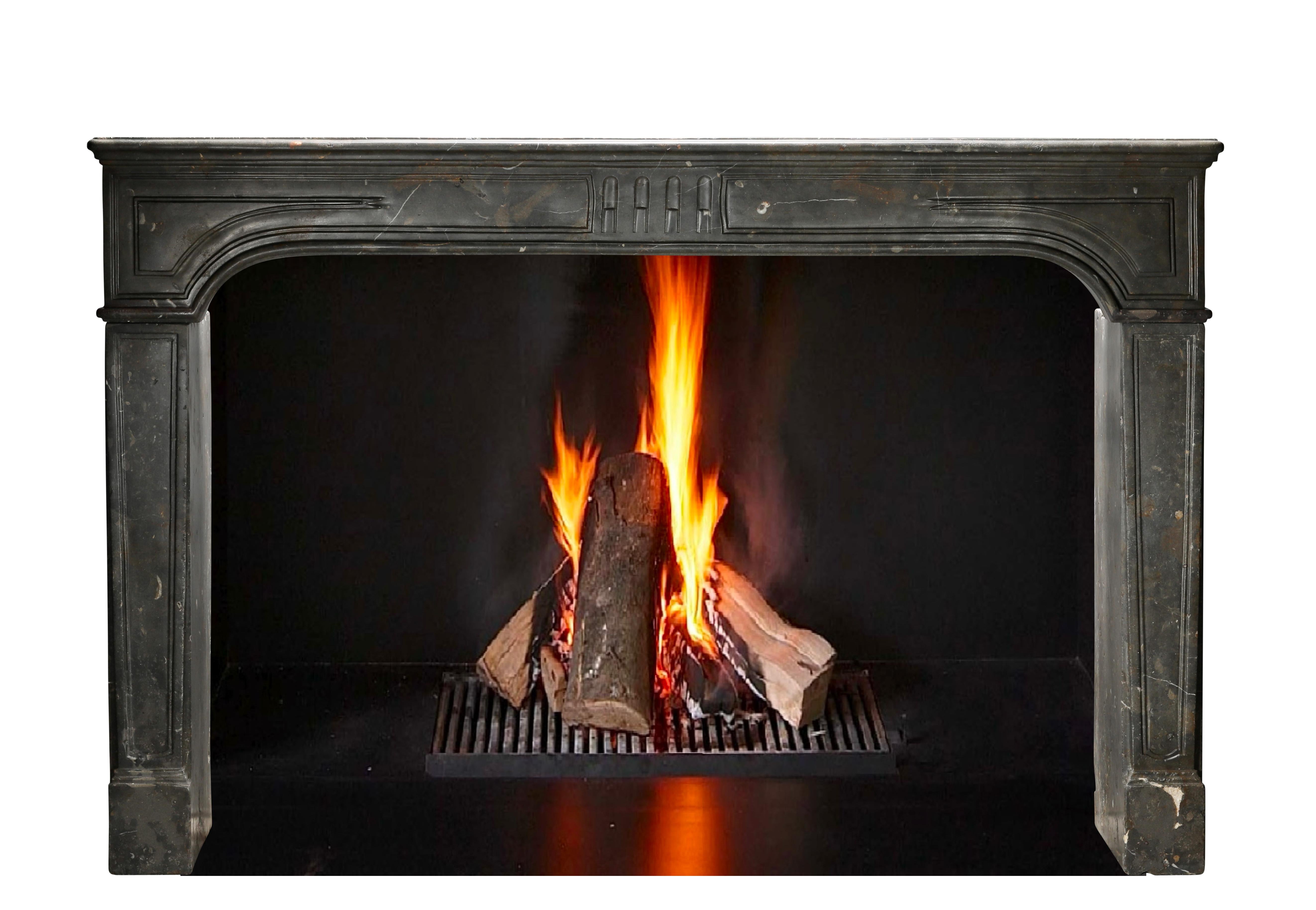 Exceptional antique fireplace surround from France. This 18th century period mantel piece is unique in size, execution and colour of the stone. The stone comes out of the beaujolais region. This is a statement decor element as they are rarely