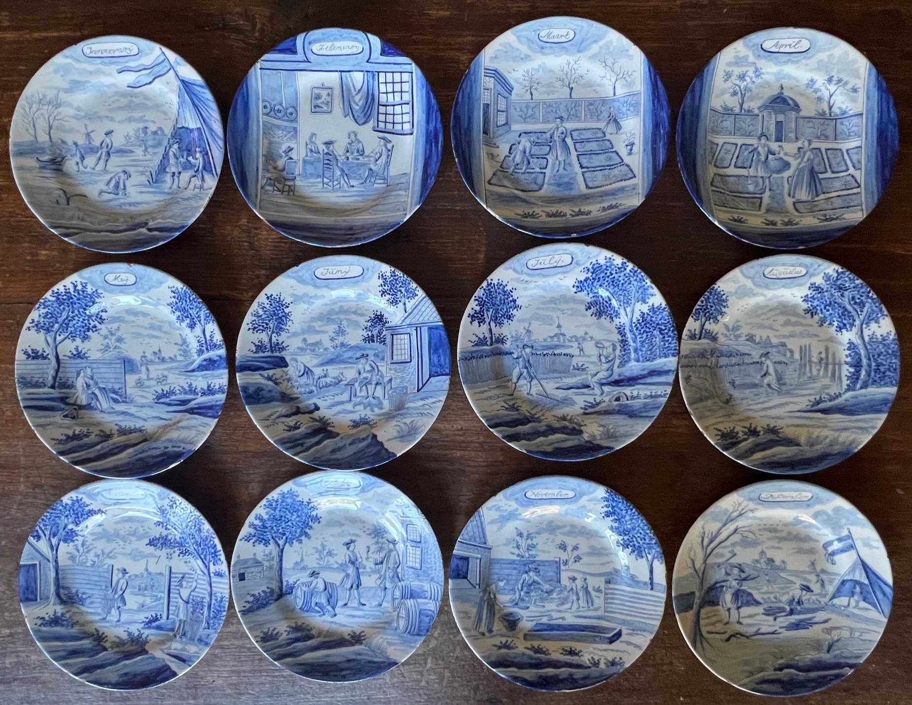 Antique hand painted earthenware plates in blue and white Dutch faience made in the mid to late 1700's. Each plate is painted with a different month at the top and shows a depiction of the season on each. Paintings by various renown artists of the
