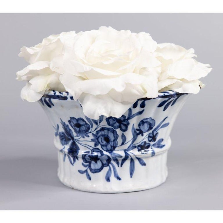 A beautiful antique 18th-Century Delft Dutch faience flower brick wall pocket. This lovely vase has a ribbed design and a hand painted floral pattern in the traditional Delft cobalt blue and white colors. It would look fabulous displayed on a wall