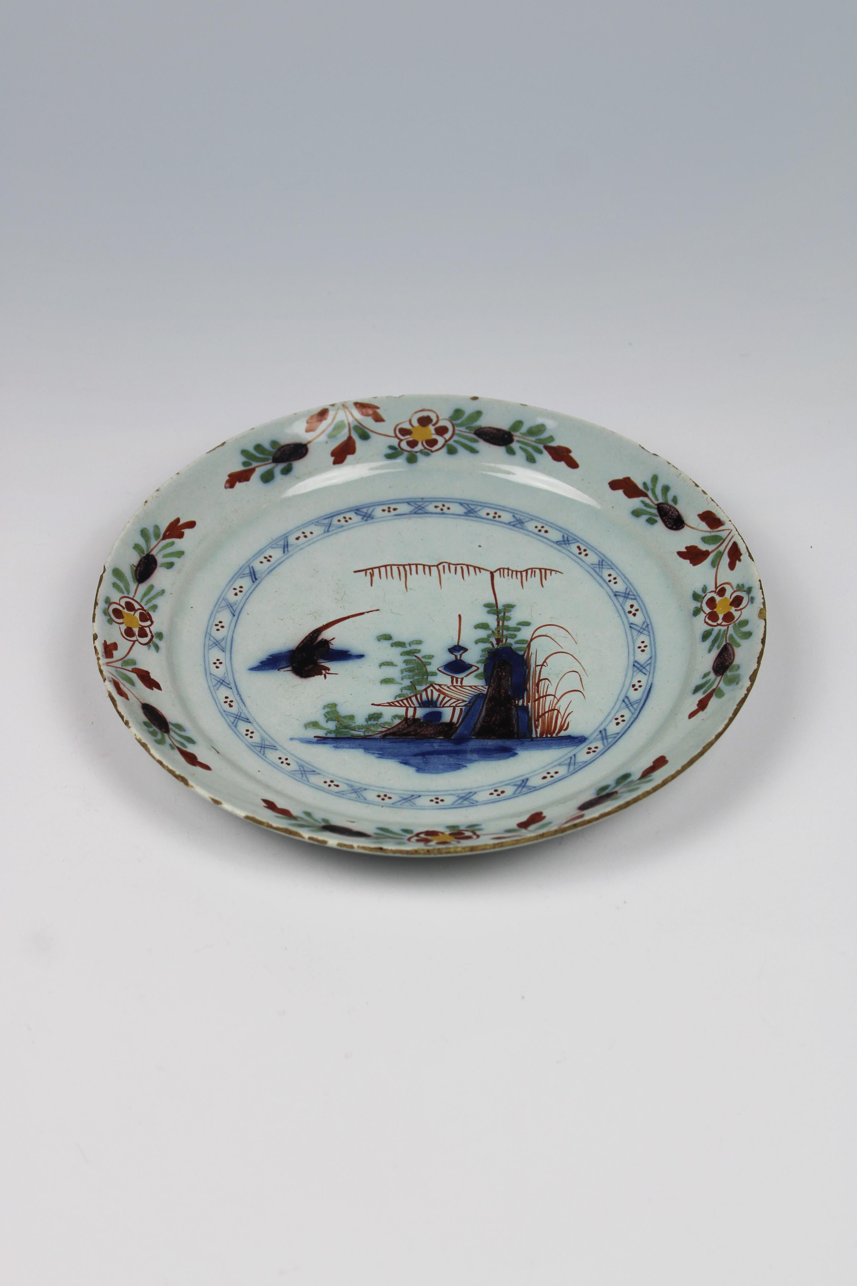 Transport yourself back in time to the 18th century with our exquisite Delft Glazed Pancake Dish, a true gem of polychrome earthenware craftsmanship from The Netherlands. This stunning dish embodies the timeless elegance and charm of traditional
