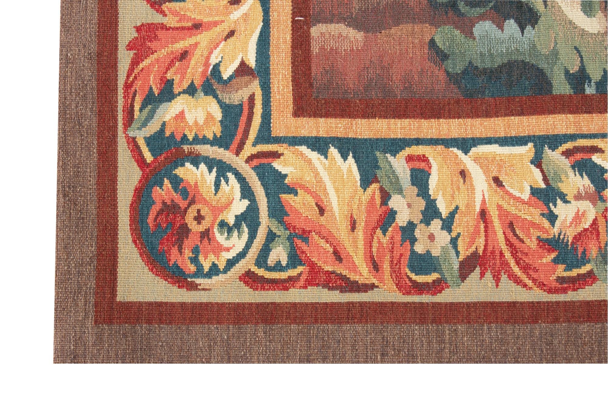 A graceful verdure tapestry in the style of those woven in the 18th century at Aubusson; one of the chief tapestry weaving towns in France. In this period landscapes with trees, birds and rivers were popular, and often included graceful
