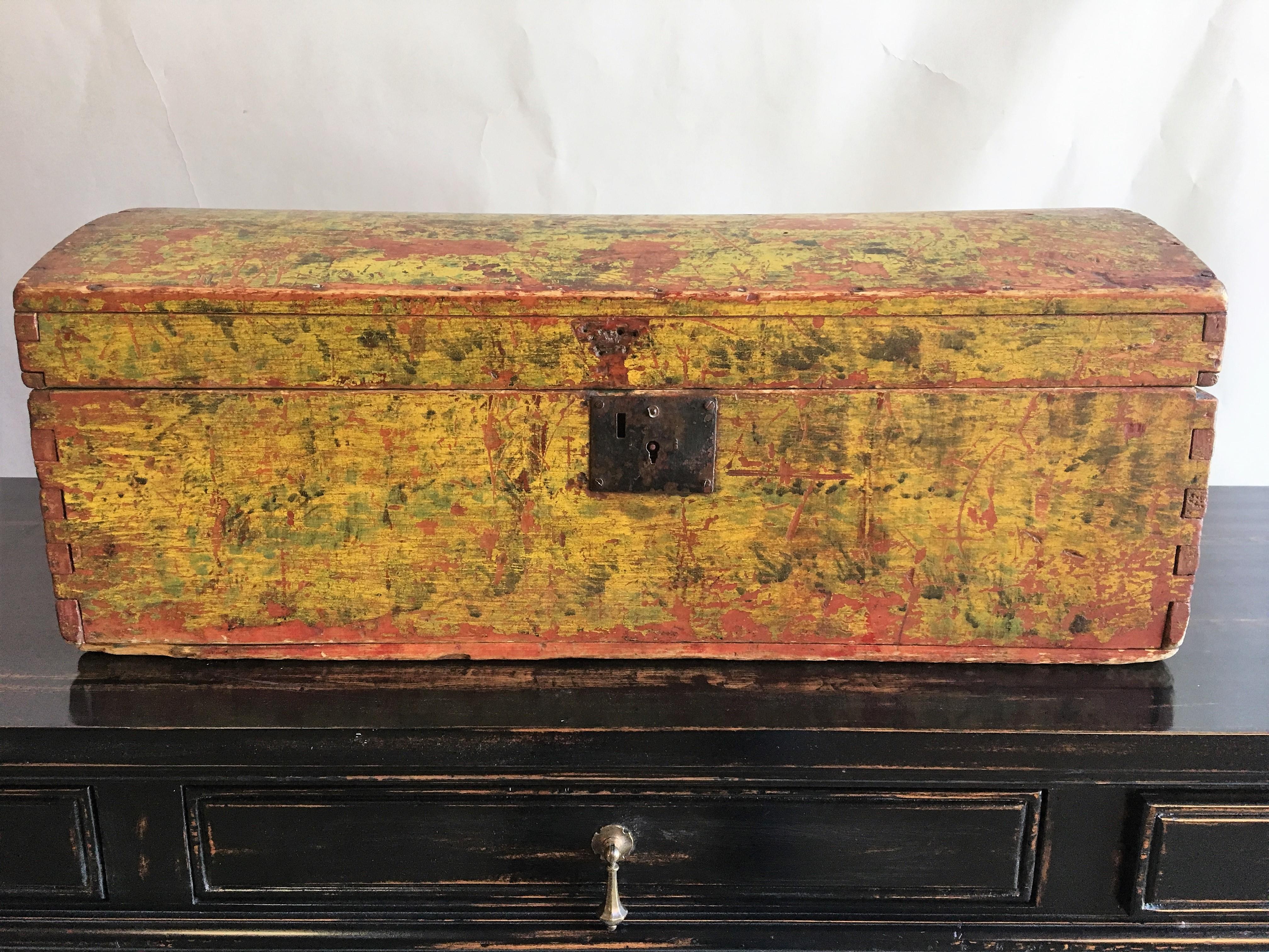 An early American dome-top box in original mustard yellow painted finish, late 18th century.