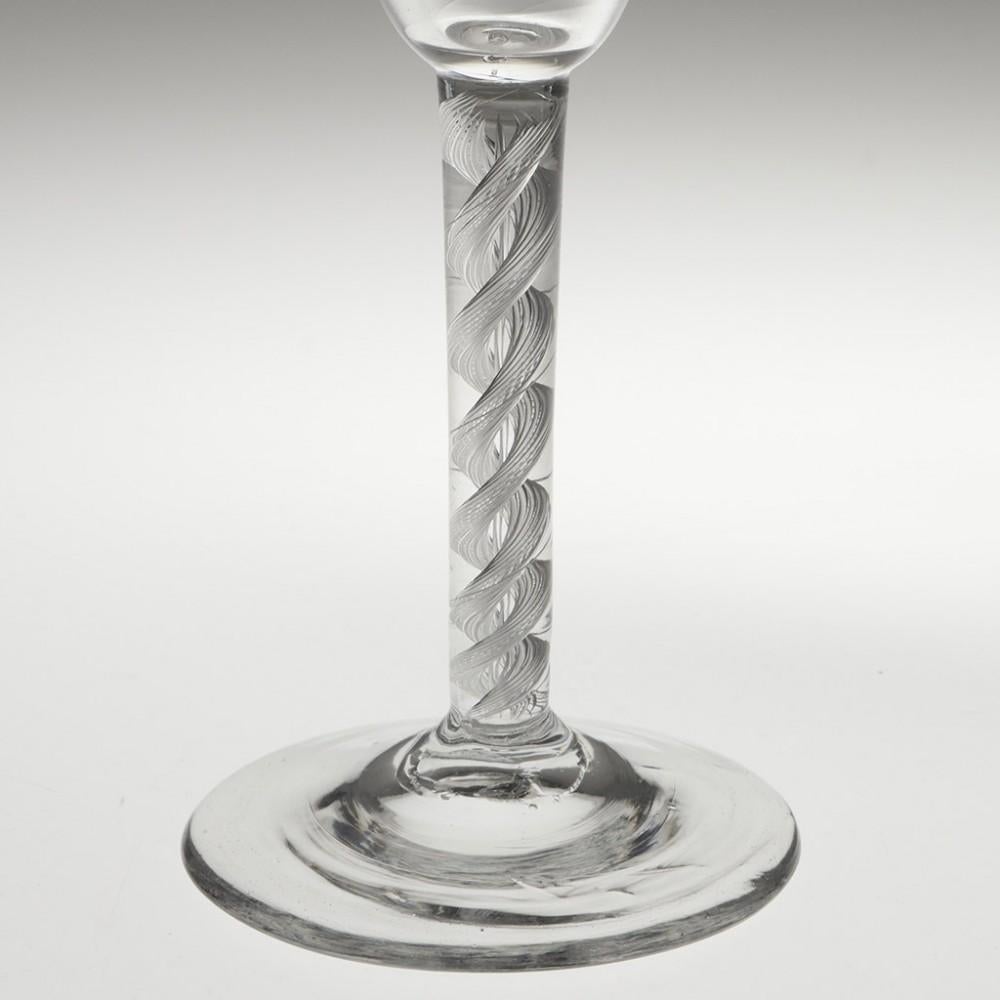 Heading : Georgian Double Series Air Twist Wine Glass c1750
Period : George II
Origin : England
Colour : Clear
Bowl : Round funnel
Stem : A pair of cable corkscrews aroung a spiral core
Foot : Conical
Pontil : Snapped
Glass Type : Lead
Size : 