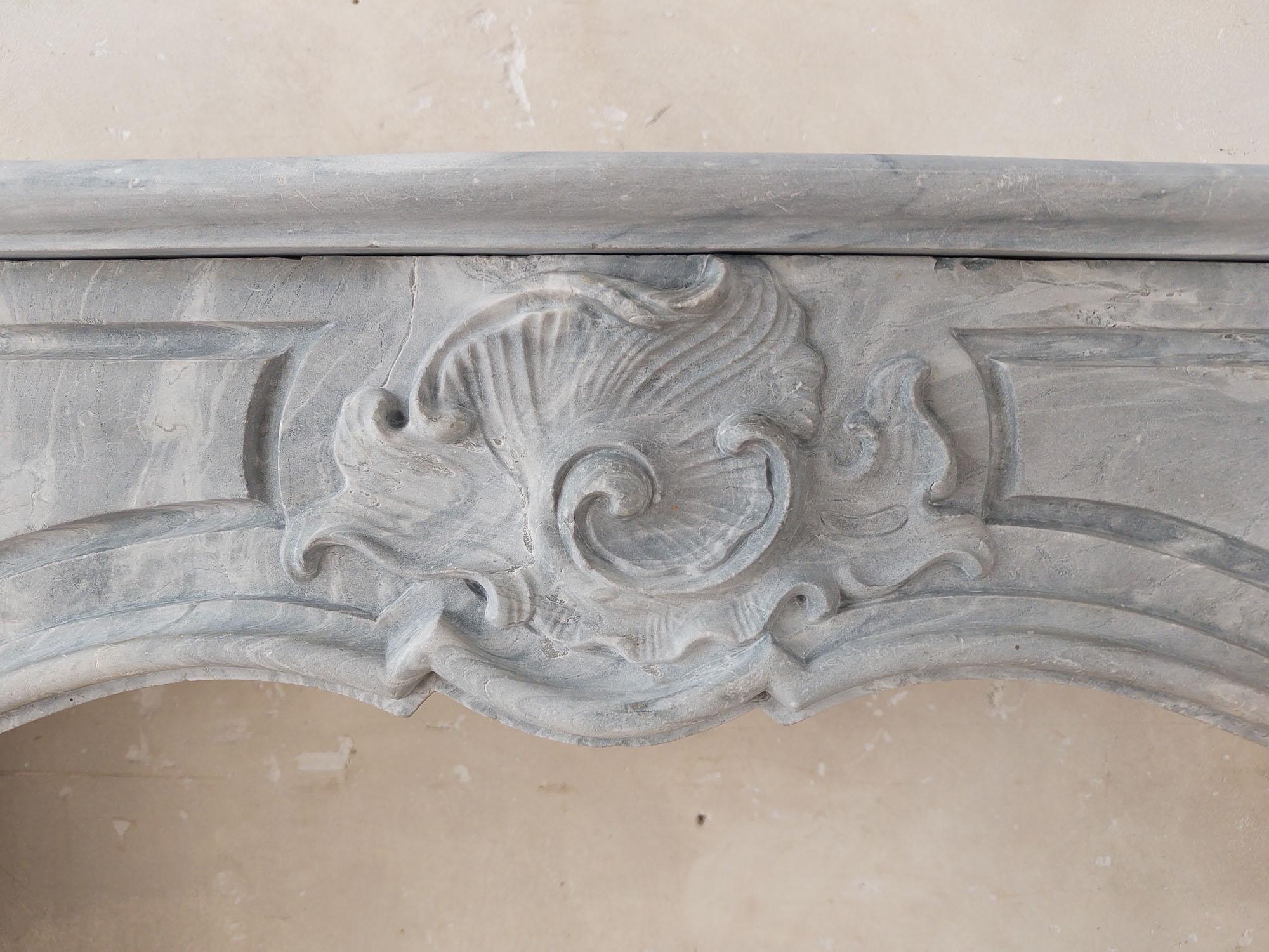 Marble 18th century Dutch Blue Turquin marble mantelpiece in Régence Style For Sale