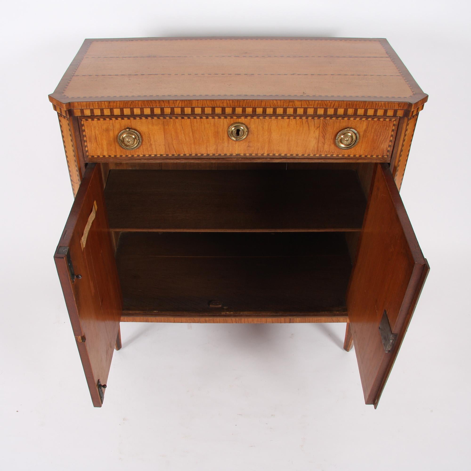 This beautiful fruitwood cabinet with stunning parquetry detail dates back to eighteenth century Holland. The cabinet is complete with a historic Sotheby's label.