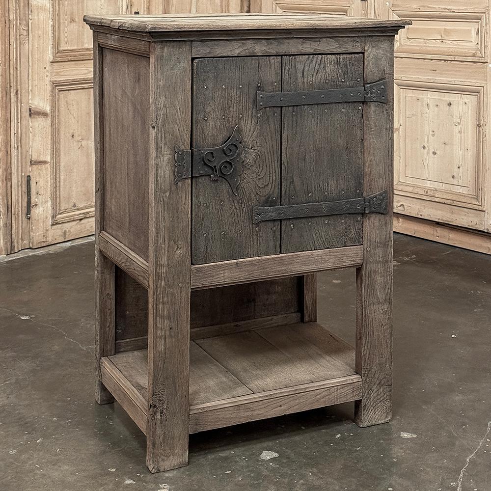 18th Century Dutch Cabinet in Stripped Oak with Wrought Iron is a charming artifact from a bygone era, when items of particular value to the lord or lady of the home would be stored under lock and key in a special cabinet.  Items could be jewelry,