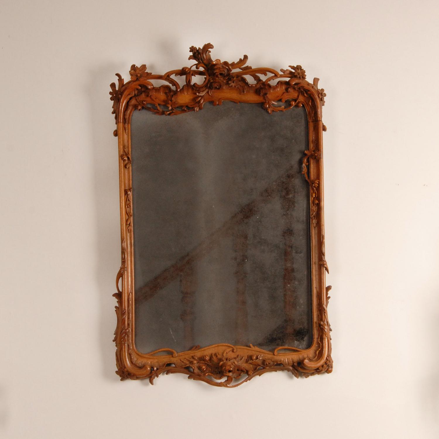 18th century Dutch Mirror Basswood Rococo

Material: Basswood, glass, Mirror
Design: Louis XV
Style: Rococo, Antique, Louis XV, 18th century, Dutch
Origin: Netherlands, 18th century
Color: Tan
Condition: Good with minor missings and repairs.
The