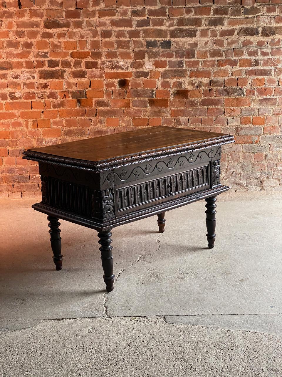 Antique 18th century Dutch provincial carved oak draw leaf table circa 1780, the rectangular panelled top fitted with one drawer in the gadrooned frieze with four grotesque mask to the corners raised on ring tuned and tapered legs, wonderful
