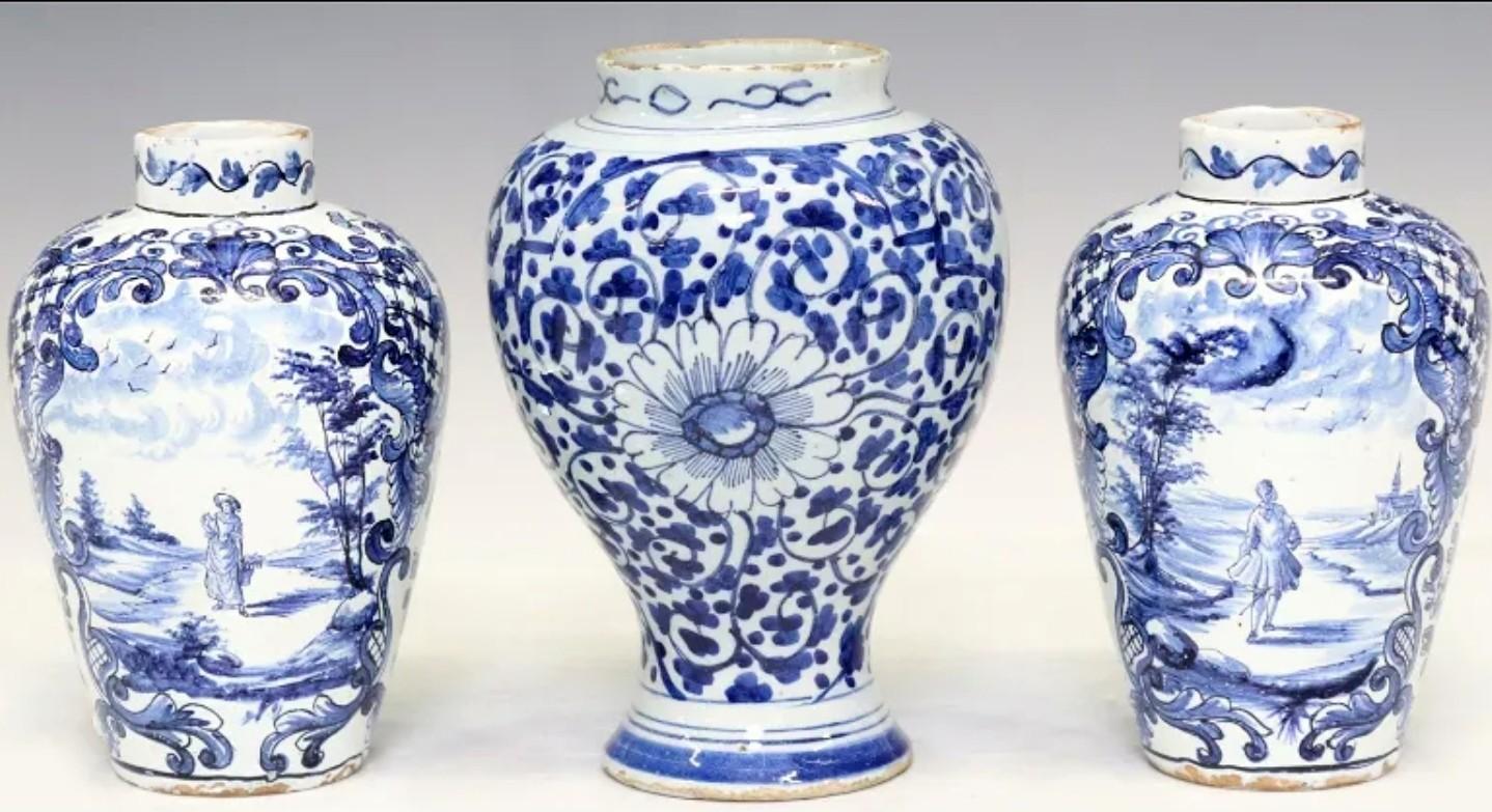 A stunning group of three antique Dutch Delftware tin-glazed pottery vessels. circa 1775

Exquisitely hand-crafted in the late 18th century, collection of three diminutive blue and white ceramic vessels, including a pair of diminutive jar form vases