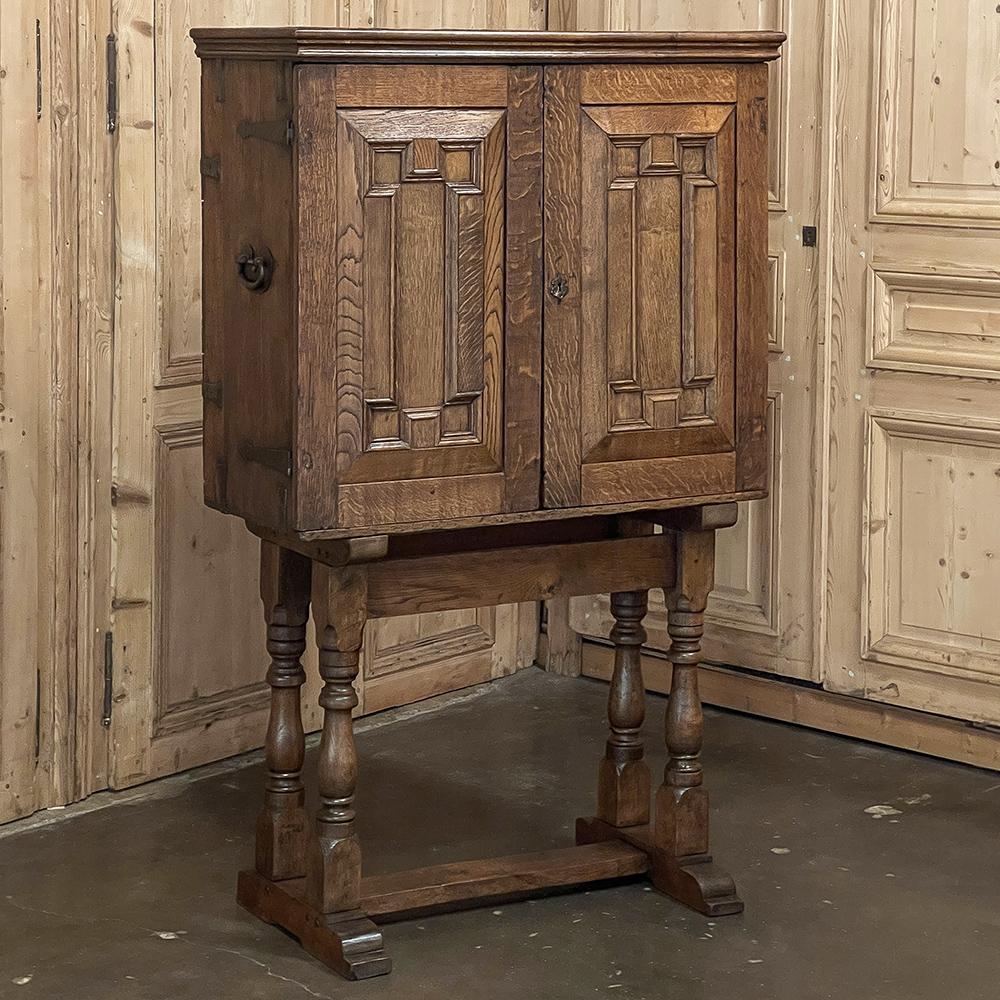 18th Century Dutch Collector's Cabinet was designed for the express purpose of keeping a wide variety of numerous collectibles in one case, and features, behind the main cabinet doors, a total of 19 interior drawers and an interior small cabinet.