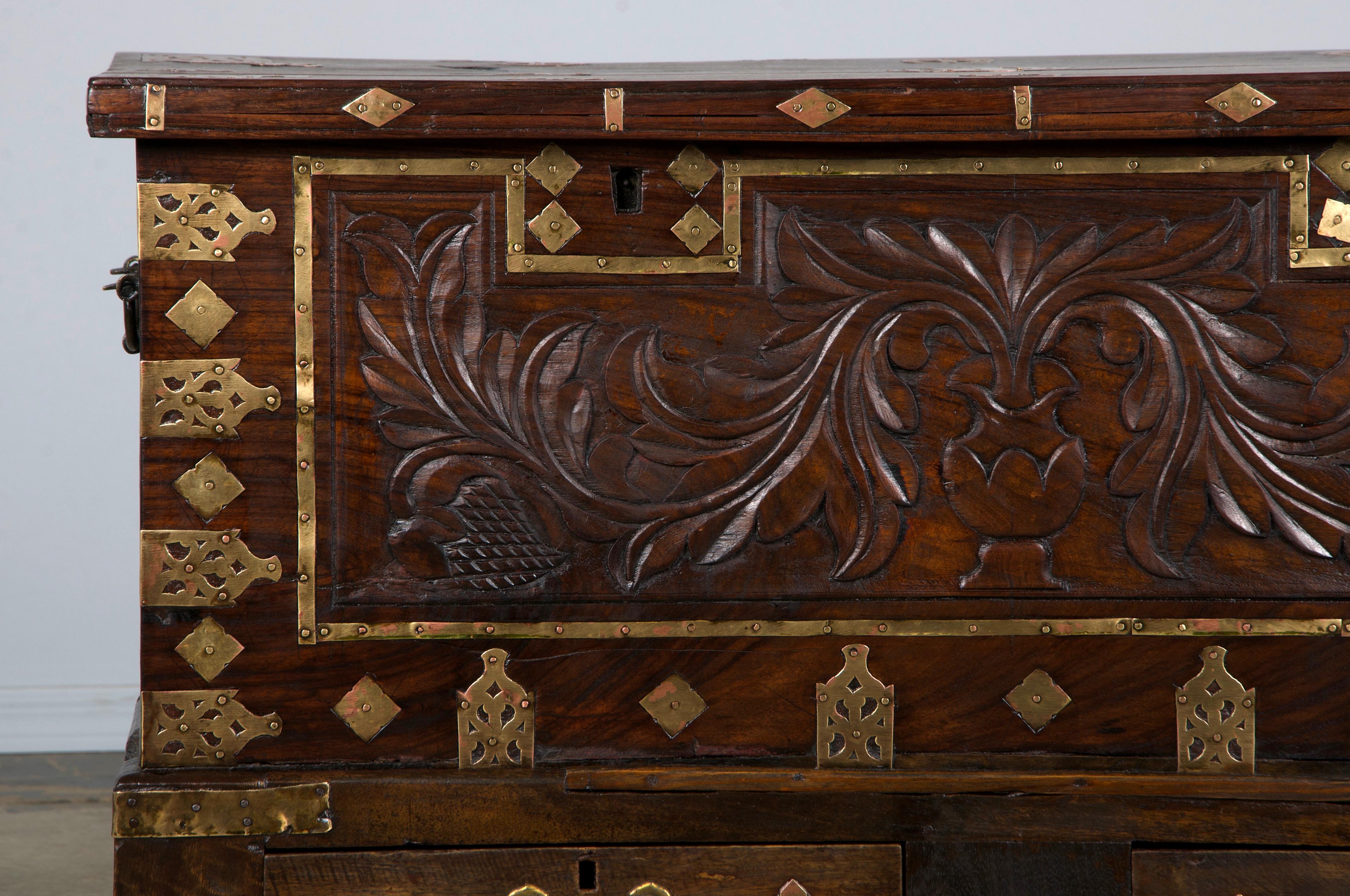 Striking mid-18th century Dutch Colonial chest, handcrafted in colonial Ceylon (modern-day Sri Lanka) during the height of the Spice Trade. Built from solid rosewood and adorned with original brass and copper mounts, this piece carries the weight,