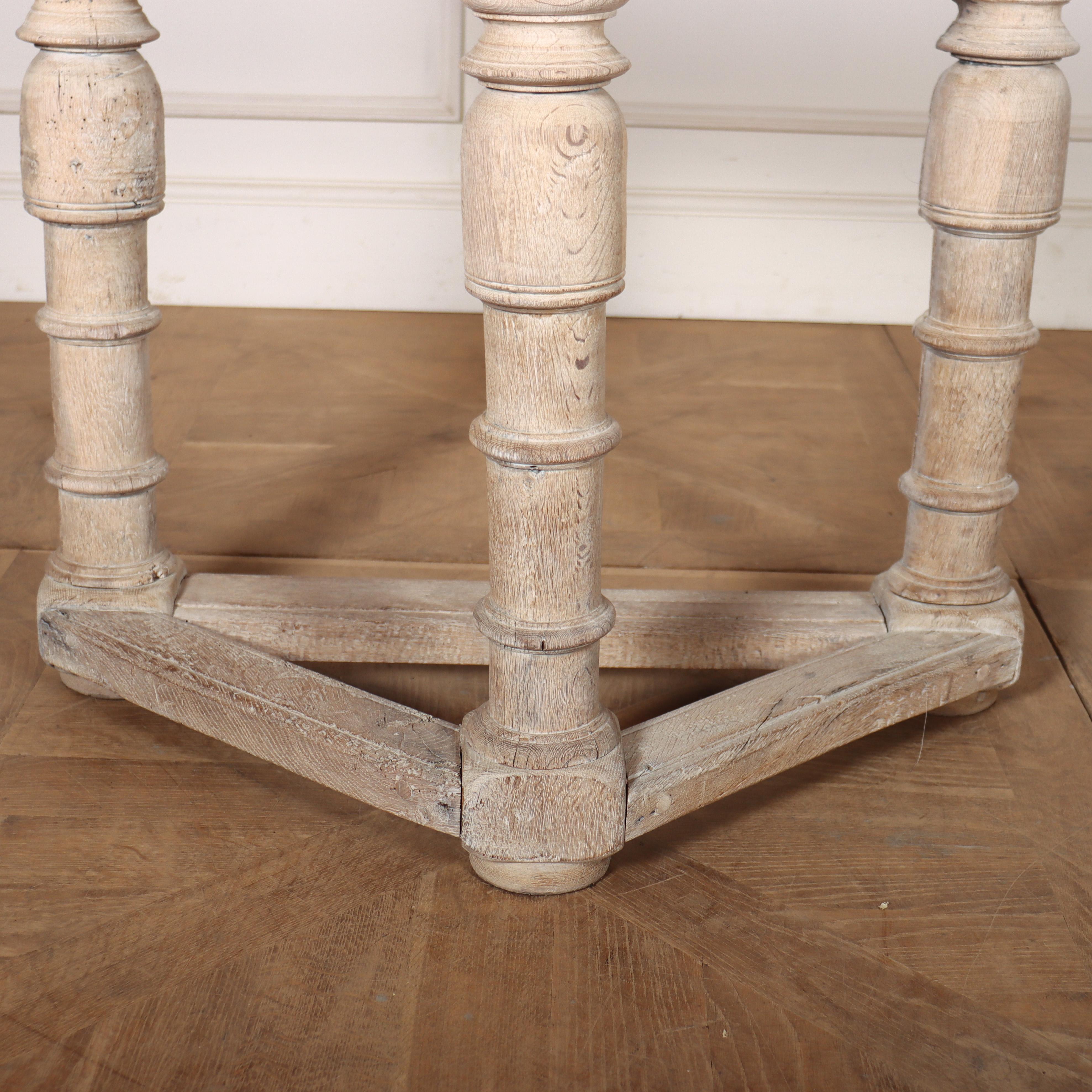 18th C Dutch bleached oak console table with a swing back leg that supports a round top. 1760.

Width when leaf is extended is 35