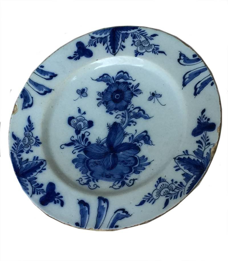 18th century Dutch delft blue large charger and three plates

The plates has a decor of a floral rock, butterflies and floral ornaments

The large charger it's size is 35 cm diagonal and 5.5 cm high
The plates sizes are 26 diagonal and 2.8 cm