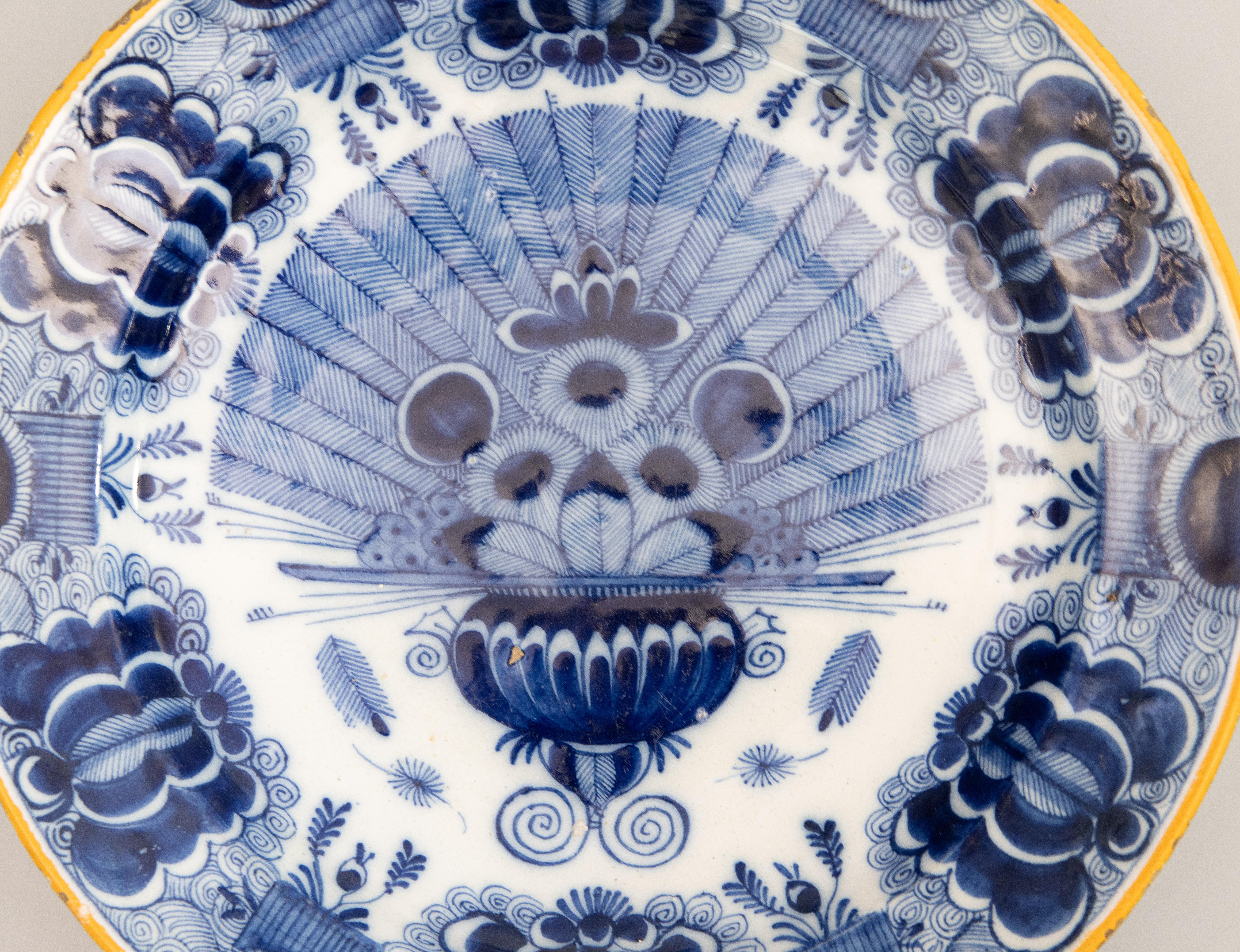 A superb antique 18th-Century Dutch Delft faience charger with the 'Peacock' pattern, circa 1750. Maker's mark on reverse: MQ/J for Quirinus Mesch. This lovely large 13.8