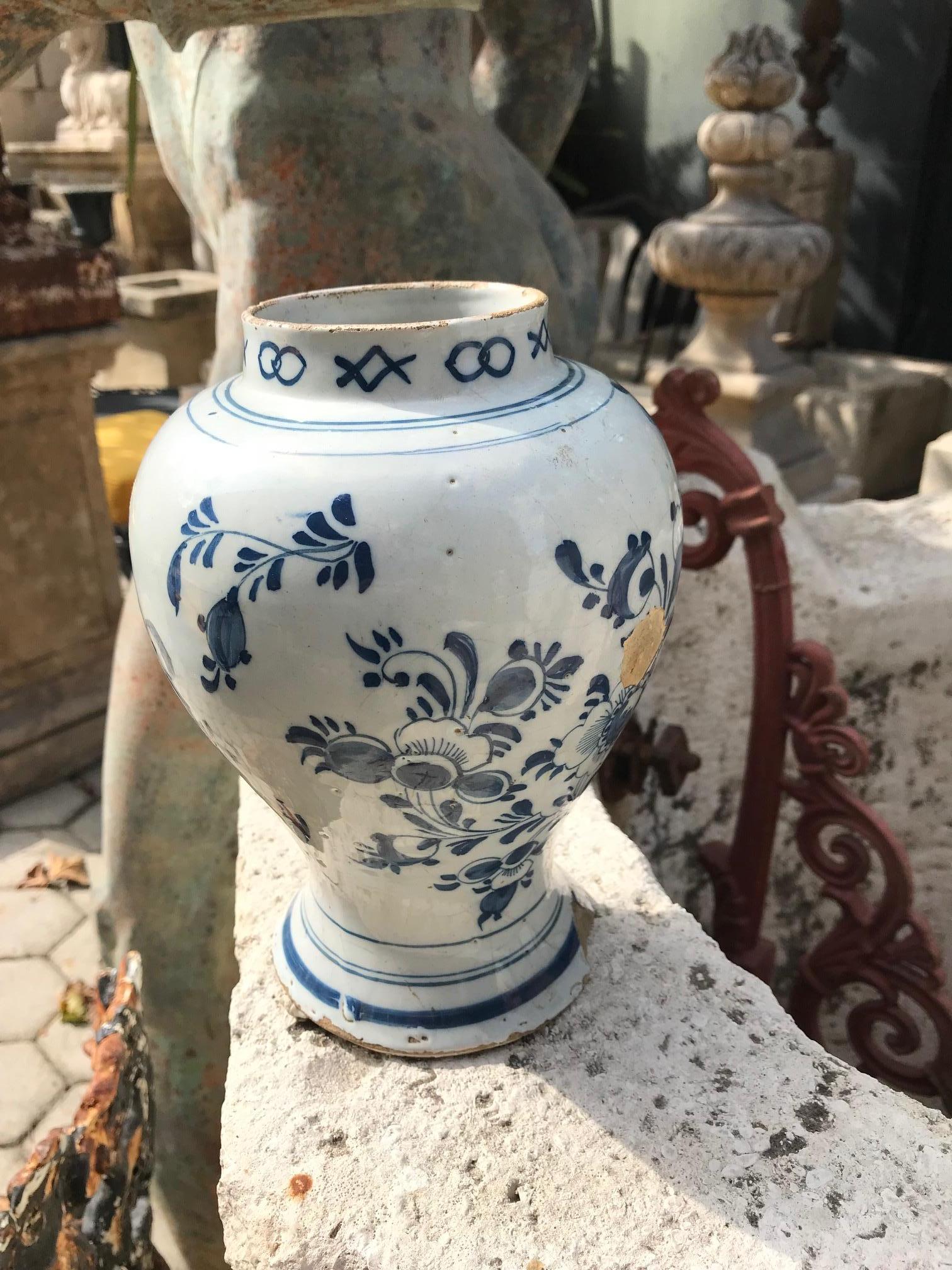 A very fine 18th century Dutch Delft Blue and White pottery vase or jar. Of typical vasiform shape with medium and deep blue Chinoiserie landscape decoration, decorated border to the top rim, and Mirrored Circles at the base . Hand painted in shades