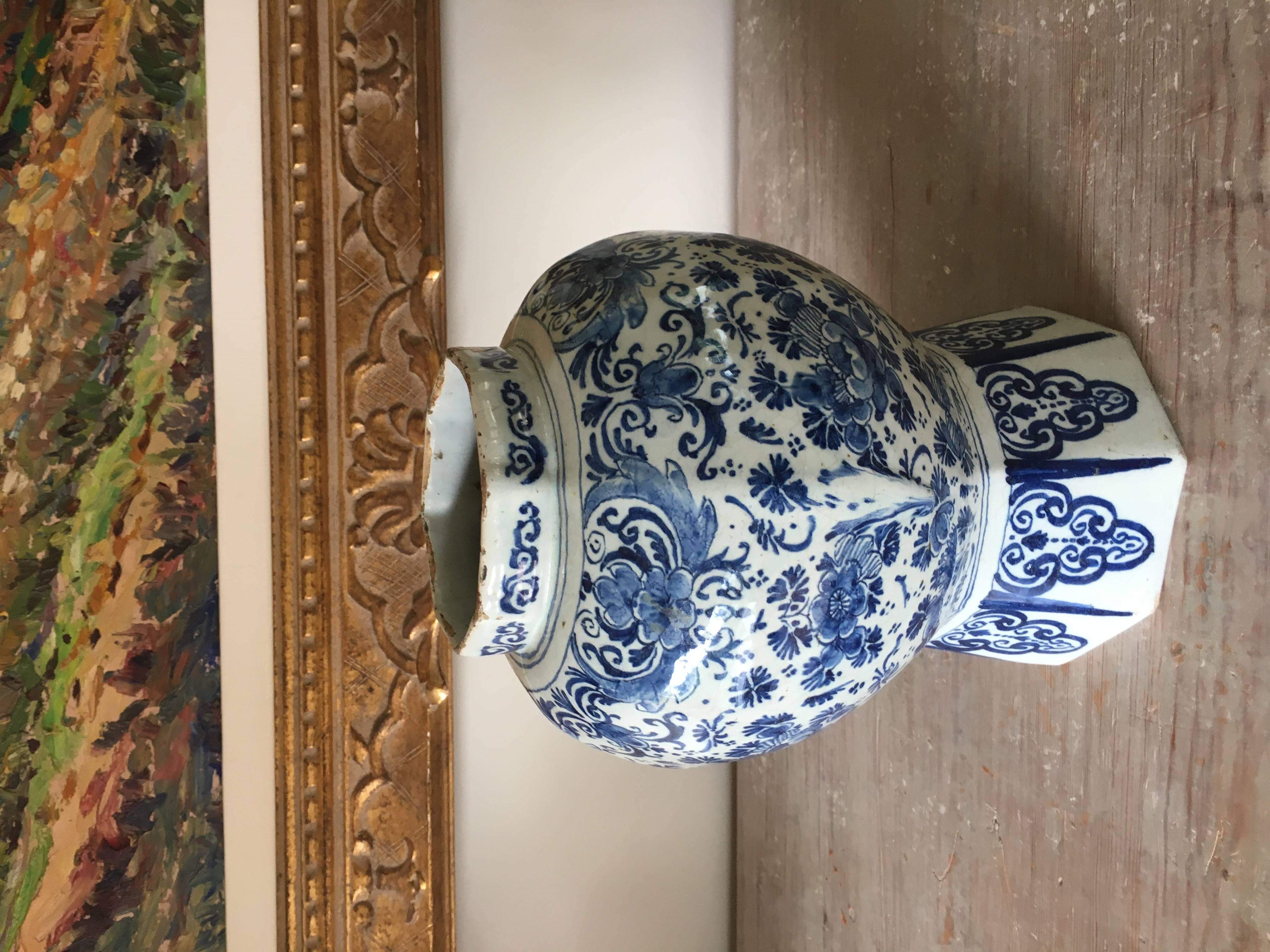 18th century delft Dutch vase. Beautiful variations of blue in a floral design. Lovely curved shape over octagonal foot. Nice large size.