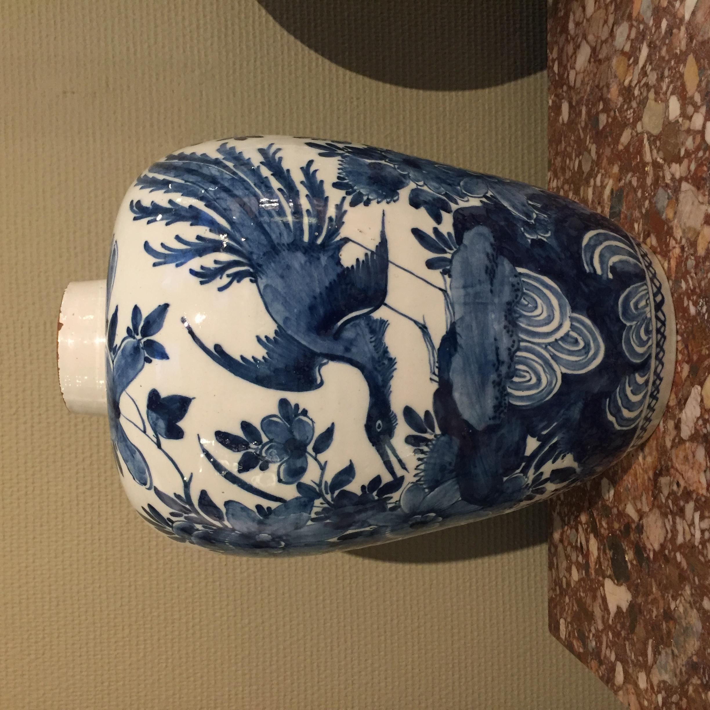The Netherlands
Delft

First half of the 18th century
Workshop unknown

A blue and white jar with chinoiserie decoration in Kangxi style with a bird of paradise in a floral landscape. At the front, we see the bird of paradise on a rock surrounded by