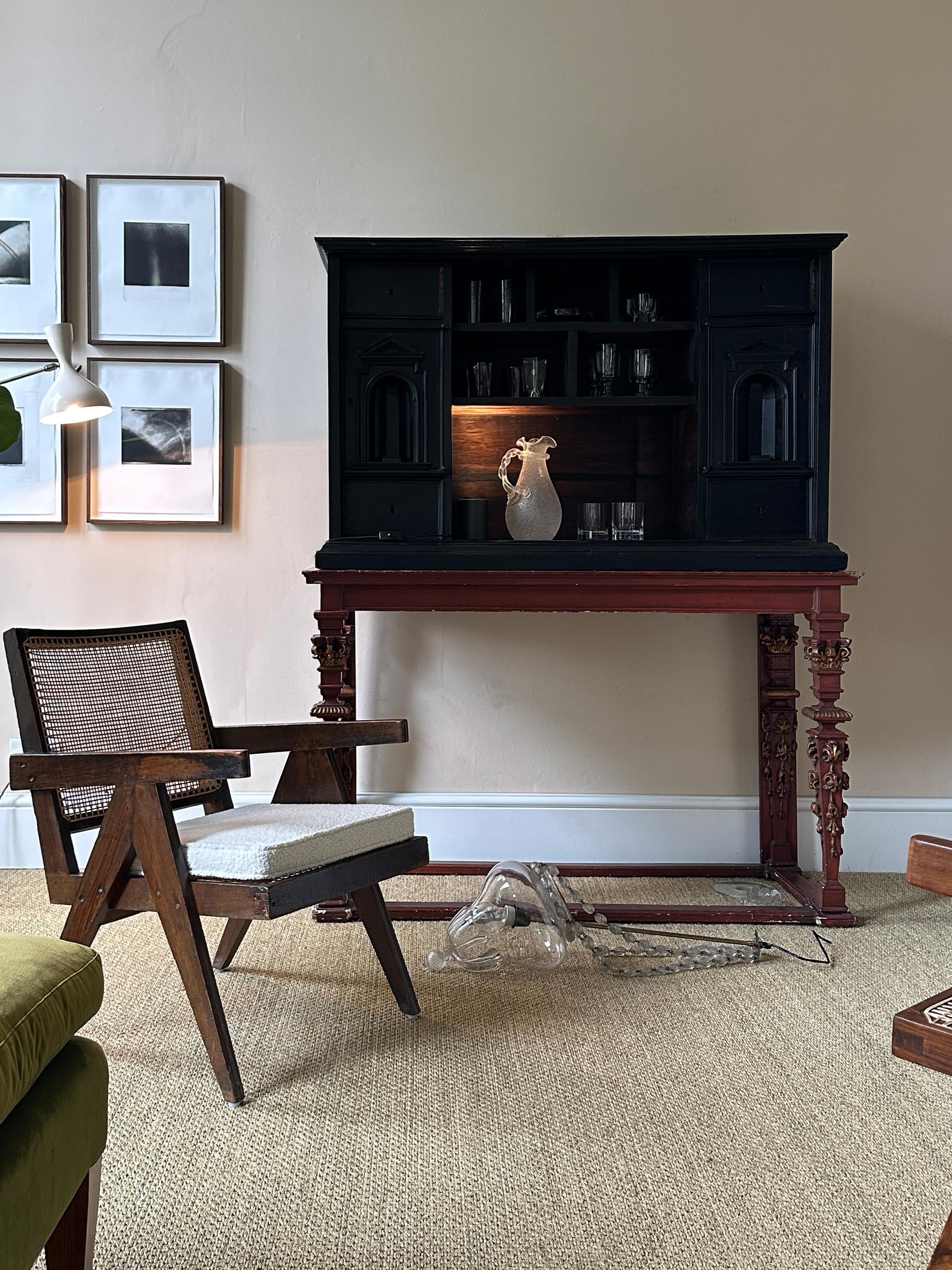 An 18th Century Dutch Ebony cabinet with elements in walnut and rosewood, mounted on a later, 19th Century, painted and parcel-gilt stand.

This piece has fantastic provenance, having previously been owned by the artist and collector Howard Hodgkin