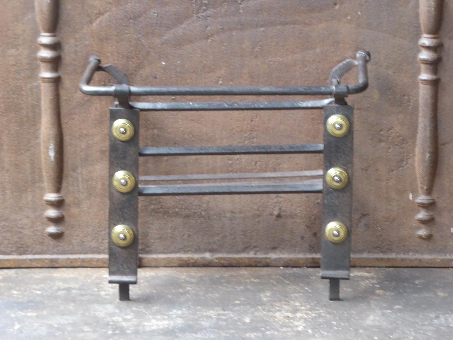 18th century Louis XV period Dutch fire grate made of wrought iron and brass. The condition is good.




   