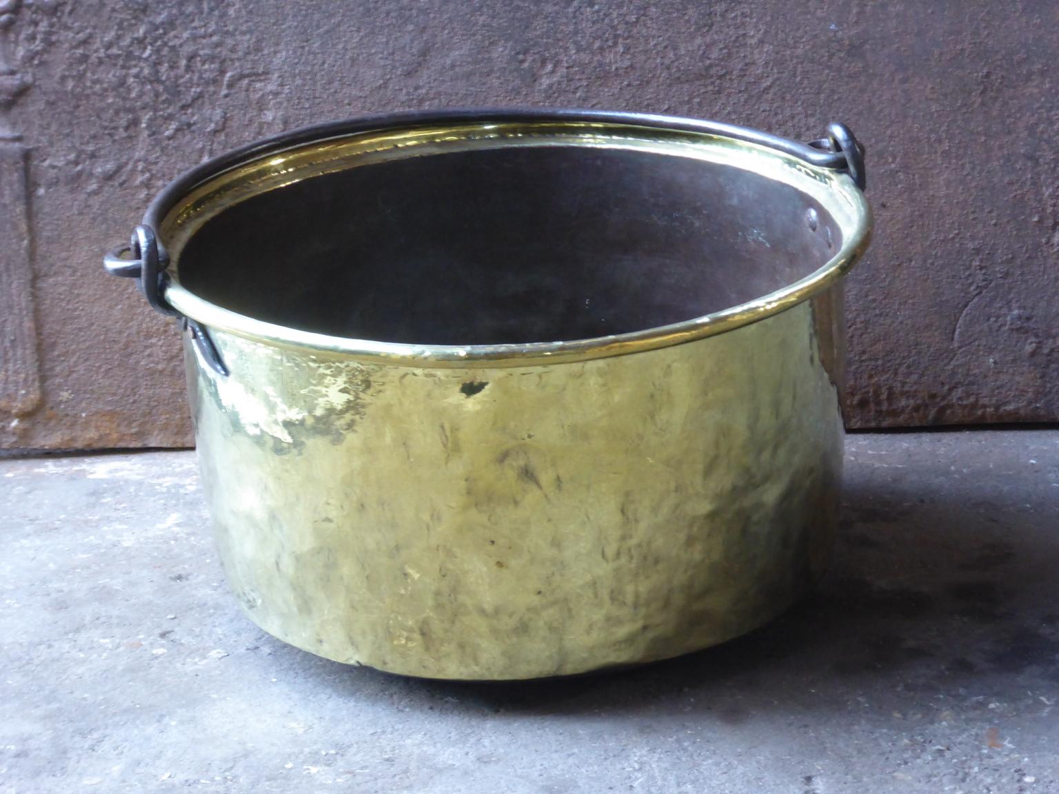 18th century Dutch log bin firewood bucket made of polished brass and wrought iron. Dutch brass kettle, also called 'aker'. Used to draw water from the well and cook over an open fire.