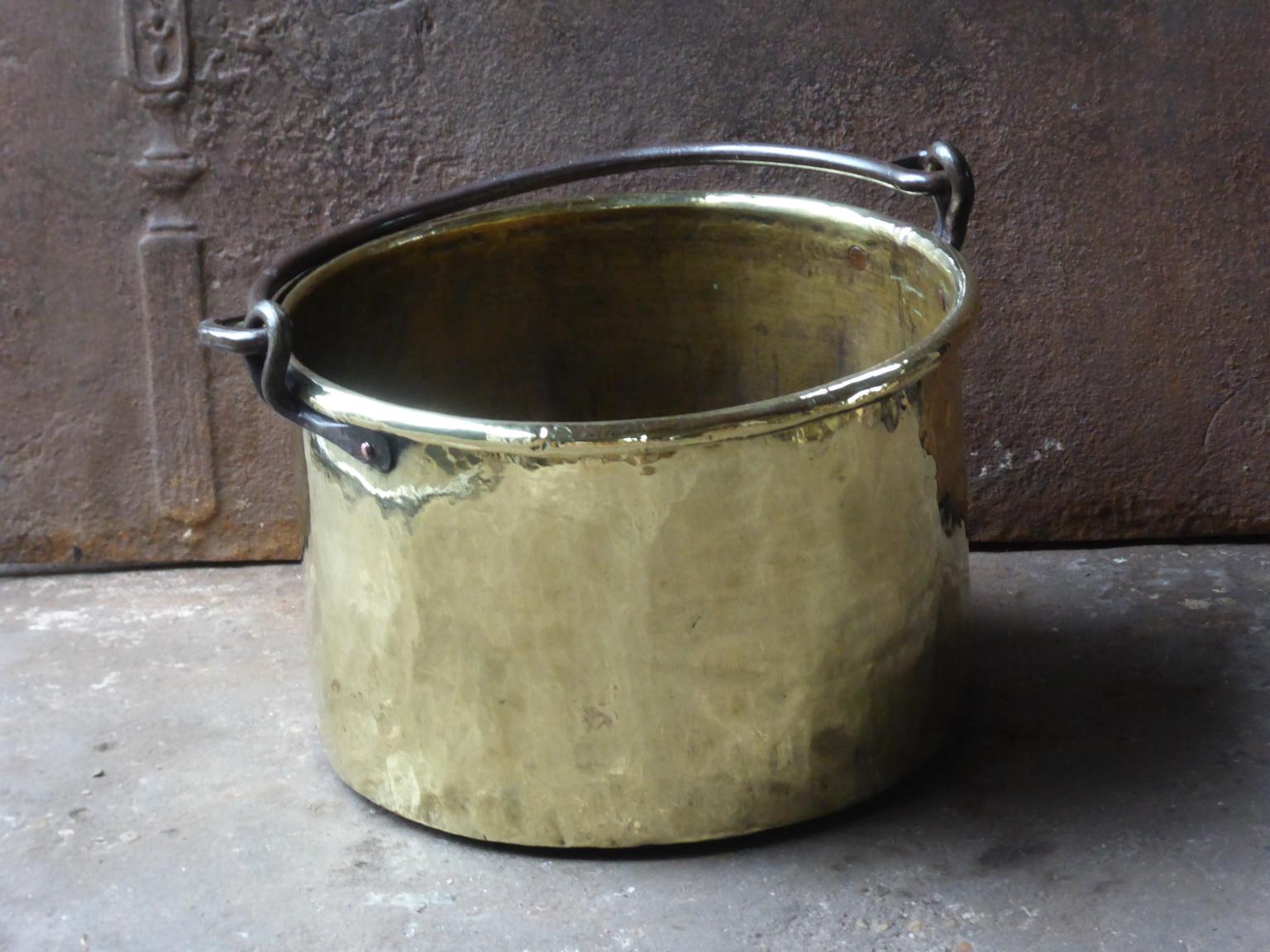 18th century Dutch log bin firewood bucket made of polished brass and wrought iron. Dutch brass kettle, also called 'aker'. Used to draw water from the well and cook over an open fire.