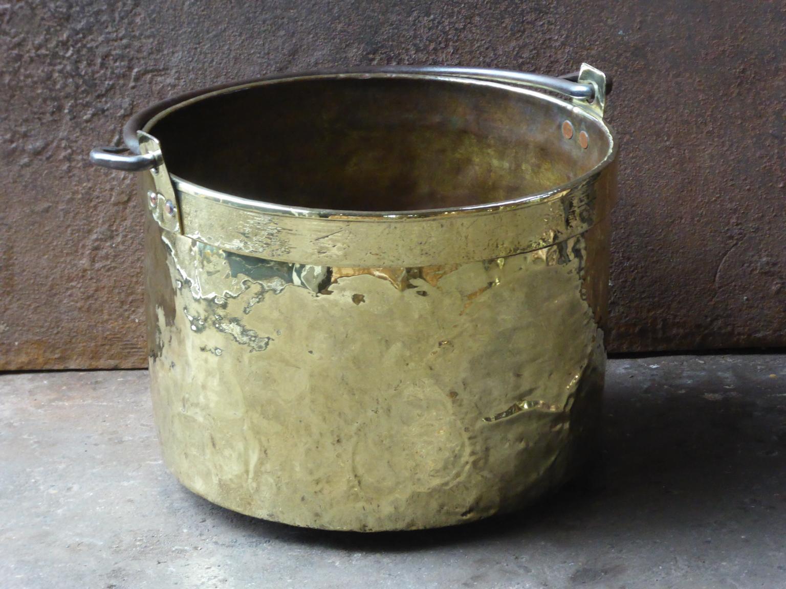 18th century Dutch log bin firewood bucket made of polished brass and wrought iron. Dutch brass kettle, also called 'aker'. Used to draw water from the well and cook over an open fire.