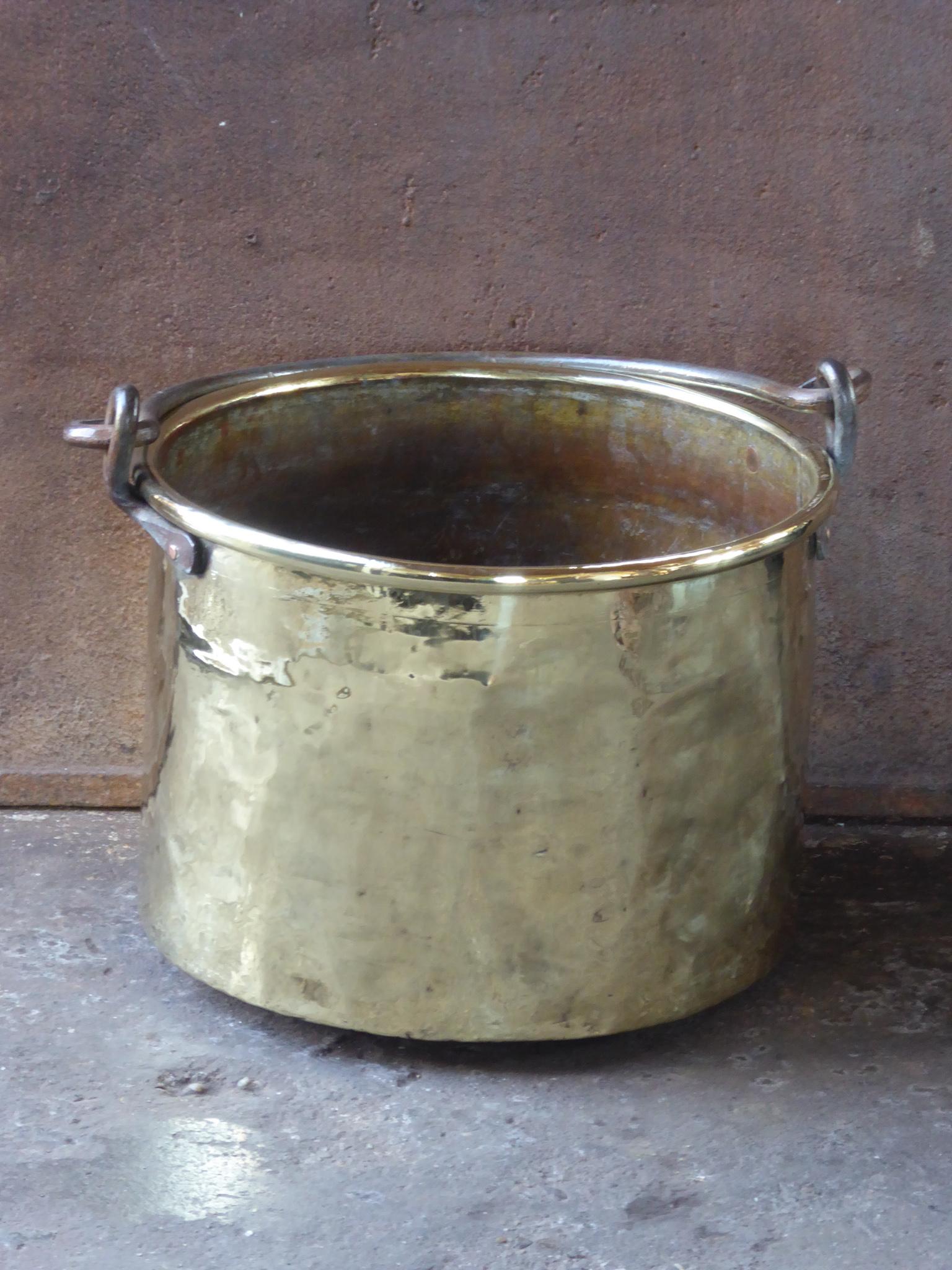 18th century Dutch log bin firewood bucket made of polished brass and wrought iron. Dutch brass kettle, also called 'aker'. Used to draw water from the well and cook over an open fire.