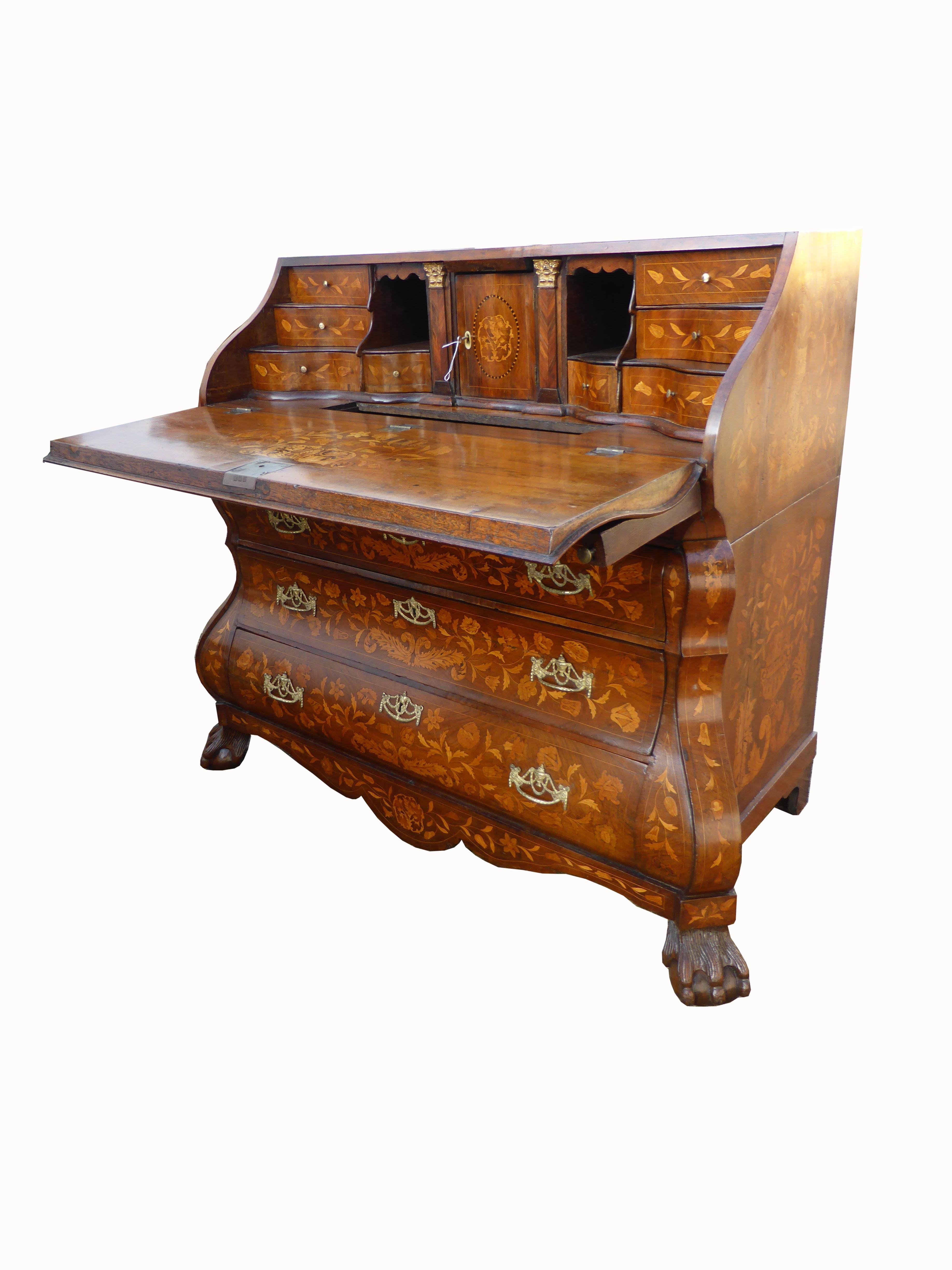 For sale is a top quality late 18th century Dutch Marquetry Bureau. The bureau is profusely inlaid all over with various birds and flowers, butterflies etc. The fall front opens to reveal a nicely fitted interior including various drawers and pigeon