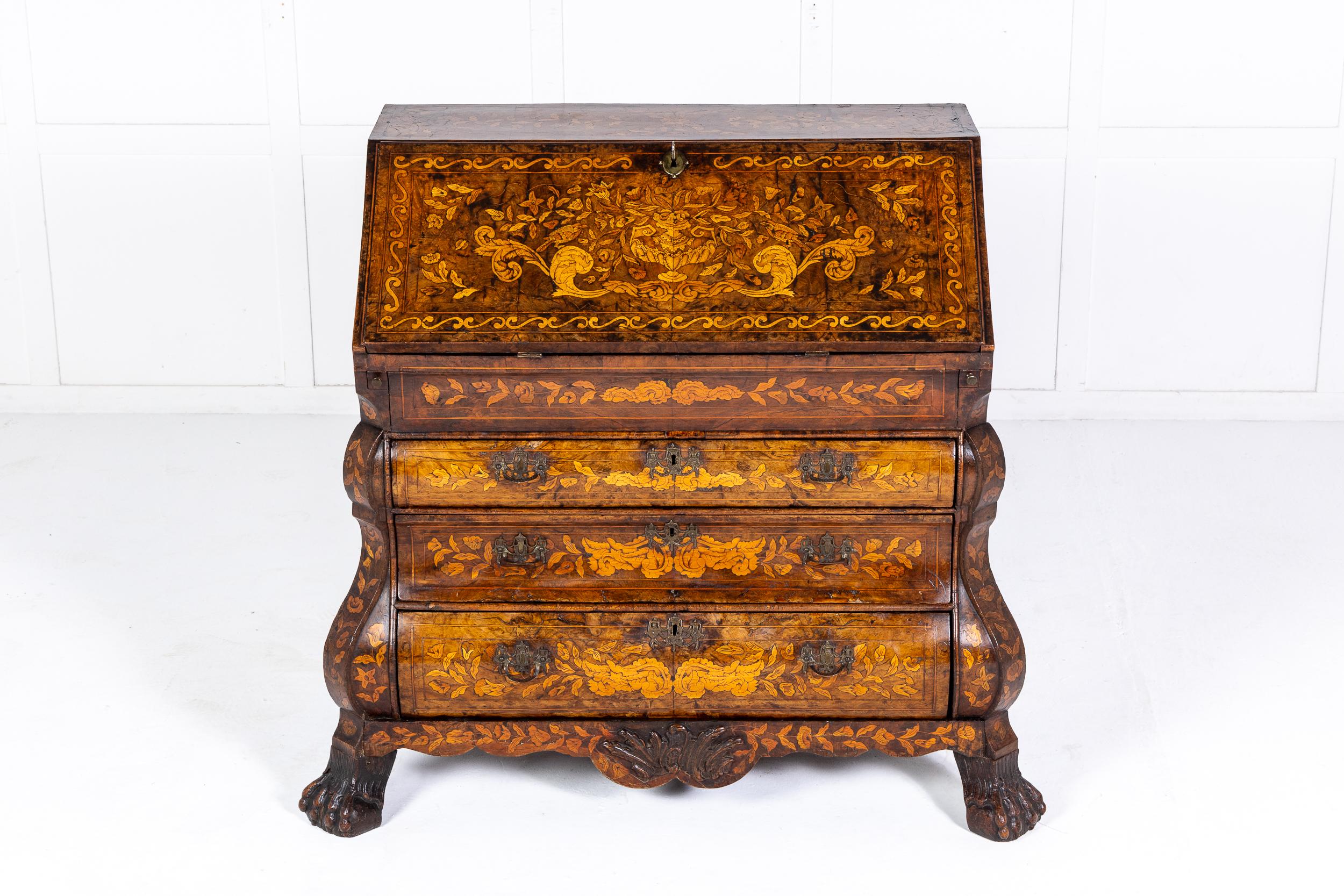 A mid to late 18th century Dutch marquetry bureau of bombe form and of exceptional quality.

The piece of typical Dutch styling for this period, the bombe form exaggerated by the corbel-like mouldings on the side. The piece is veneered in walnut of