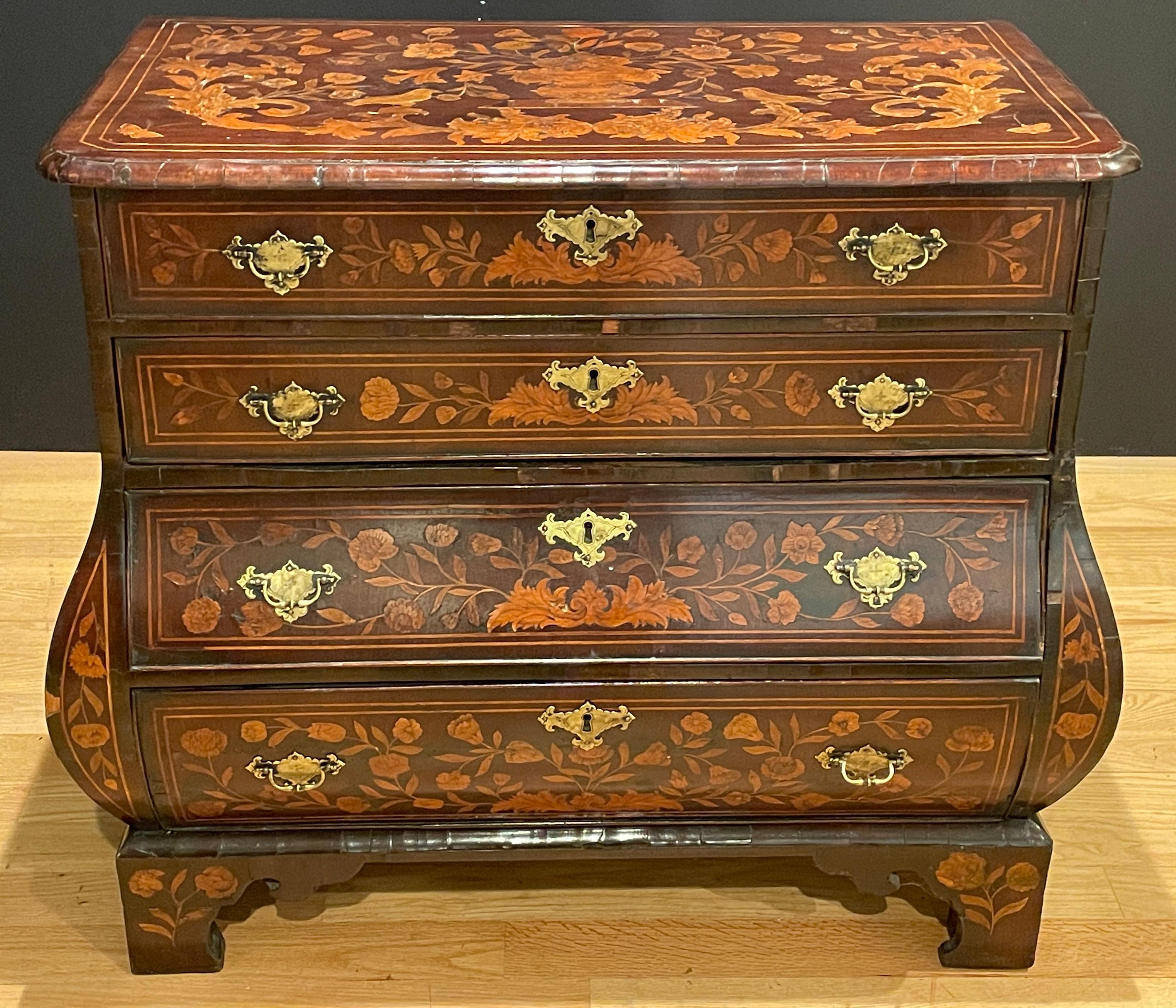 Beautiful and fine quality 18th century Dutch marquetry chest of draws. Inlay includes birds, butterflies, urns and florals. Original brasses.